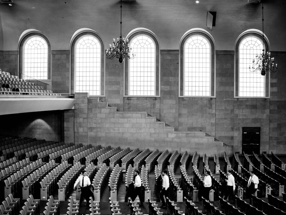 groom walking through Wait Chapel with groomsmen