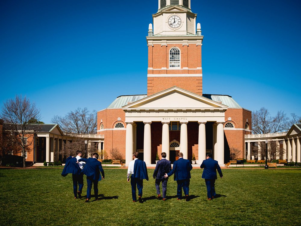 groomsmen walking outside of Wait Chapel