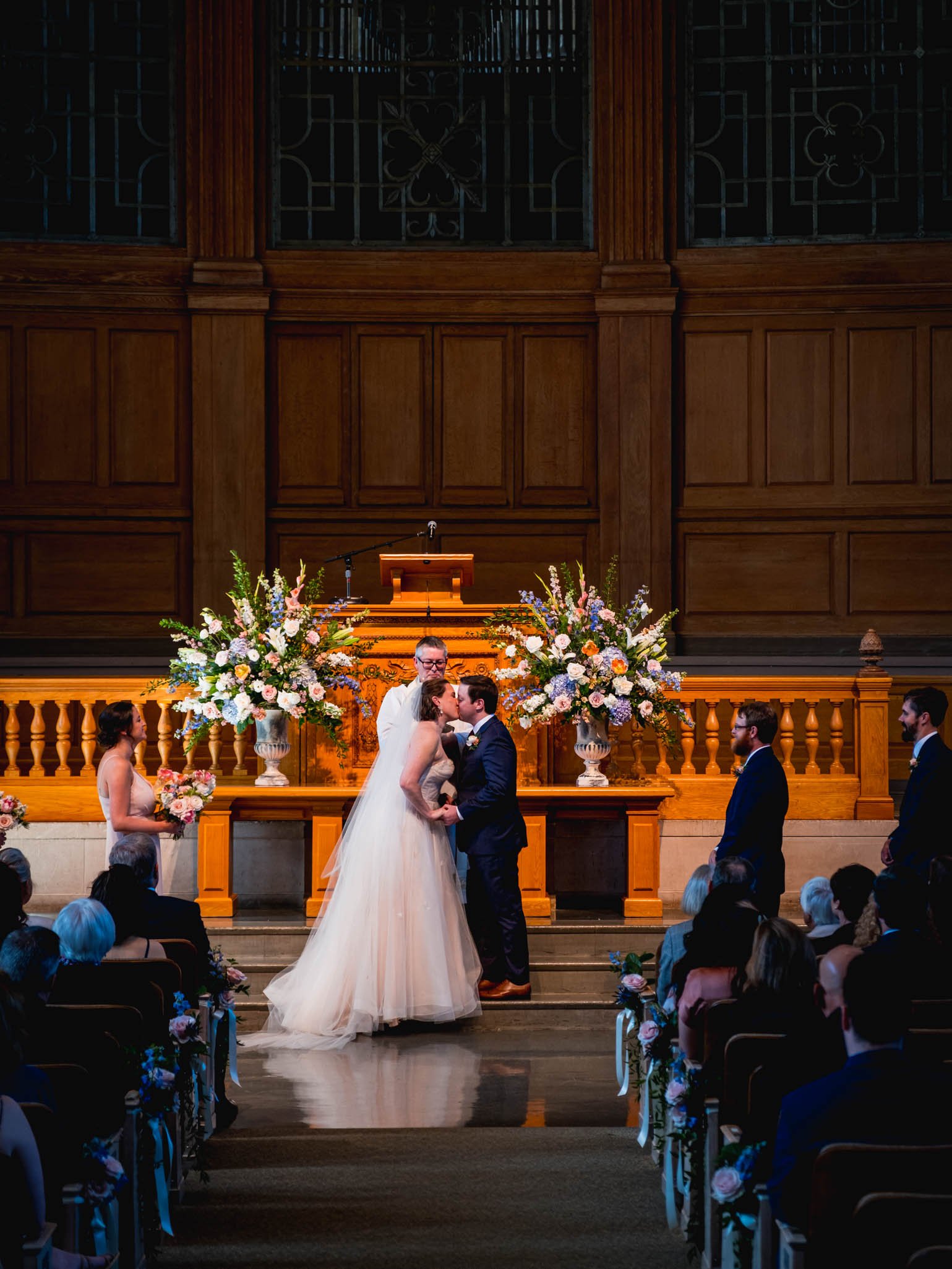 bride and groom kiss at Wait Chapel