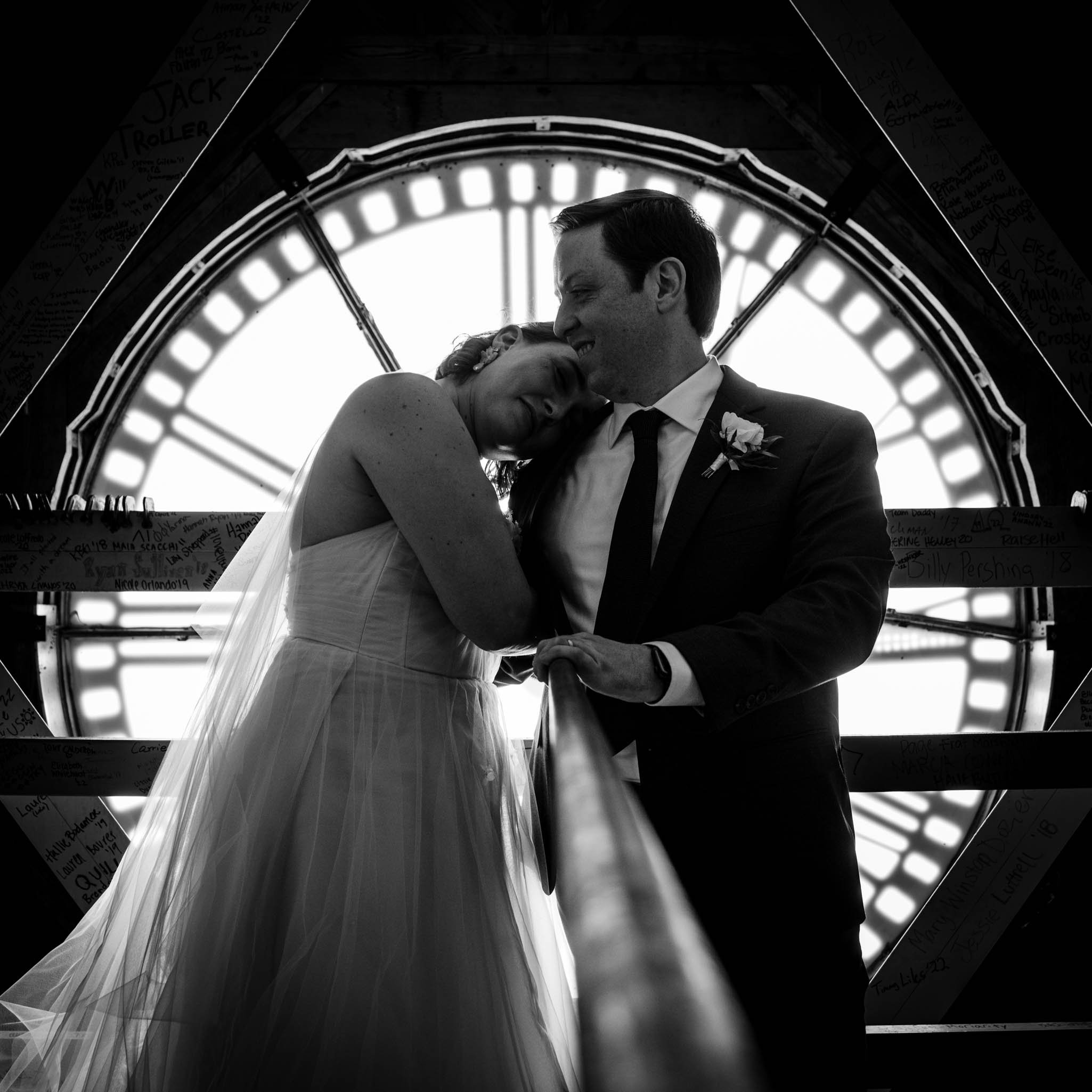 bride and groom in the clock tower of Wait Chapel