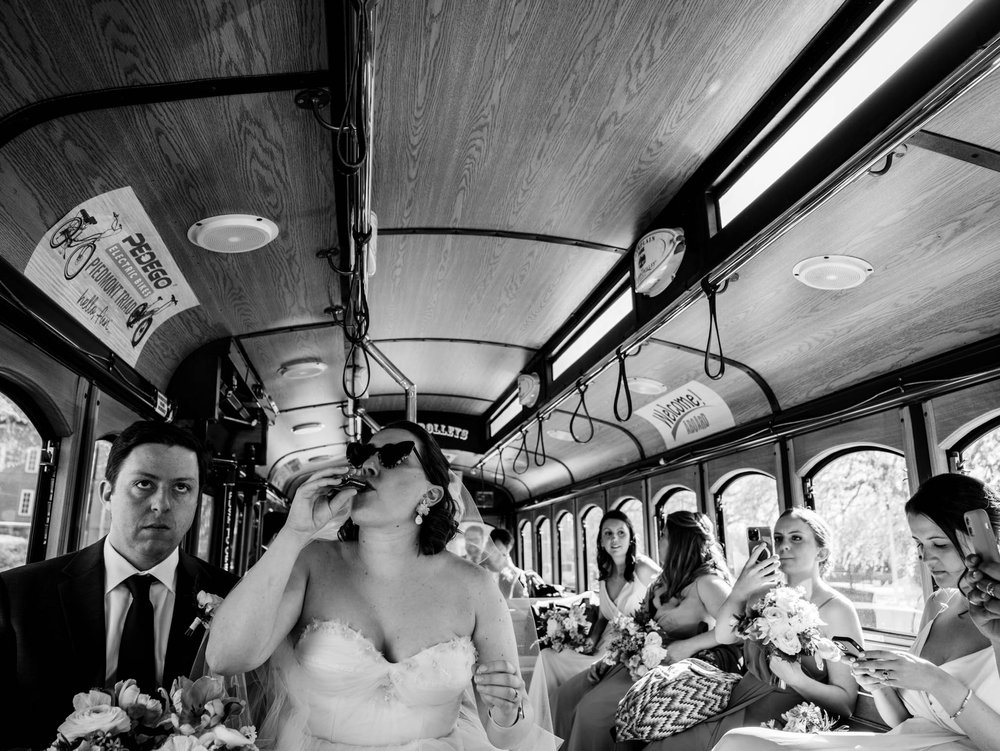 bride finishes a shots of whiskey after her wedding