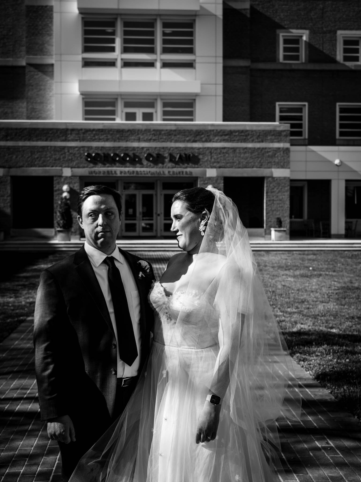 bride and groom standing outside Wake Forest School of Law