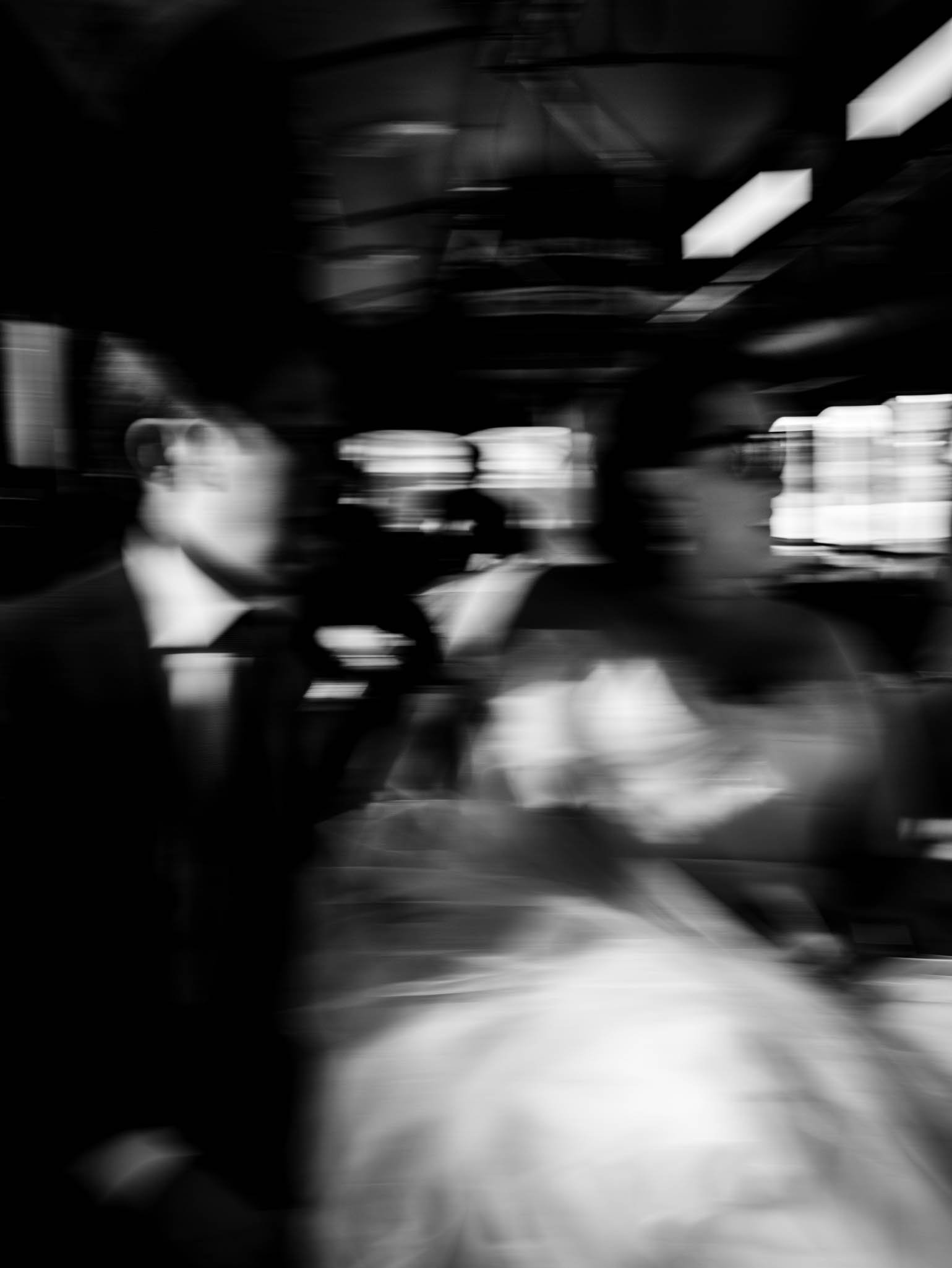 blurred photo of bride and groom on a trolley in Winston-Salem