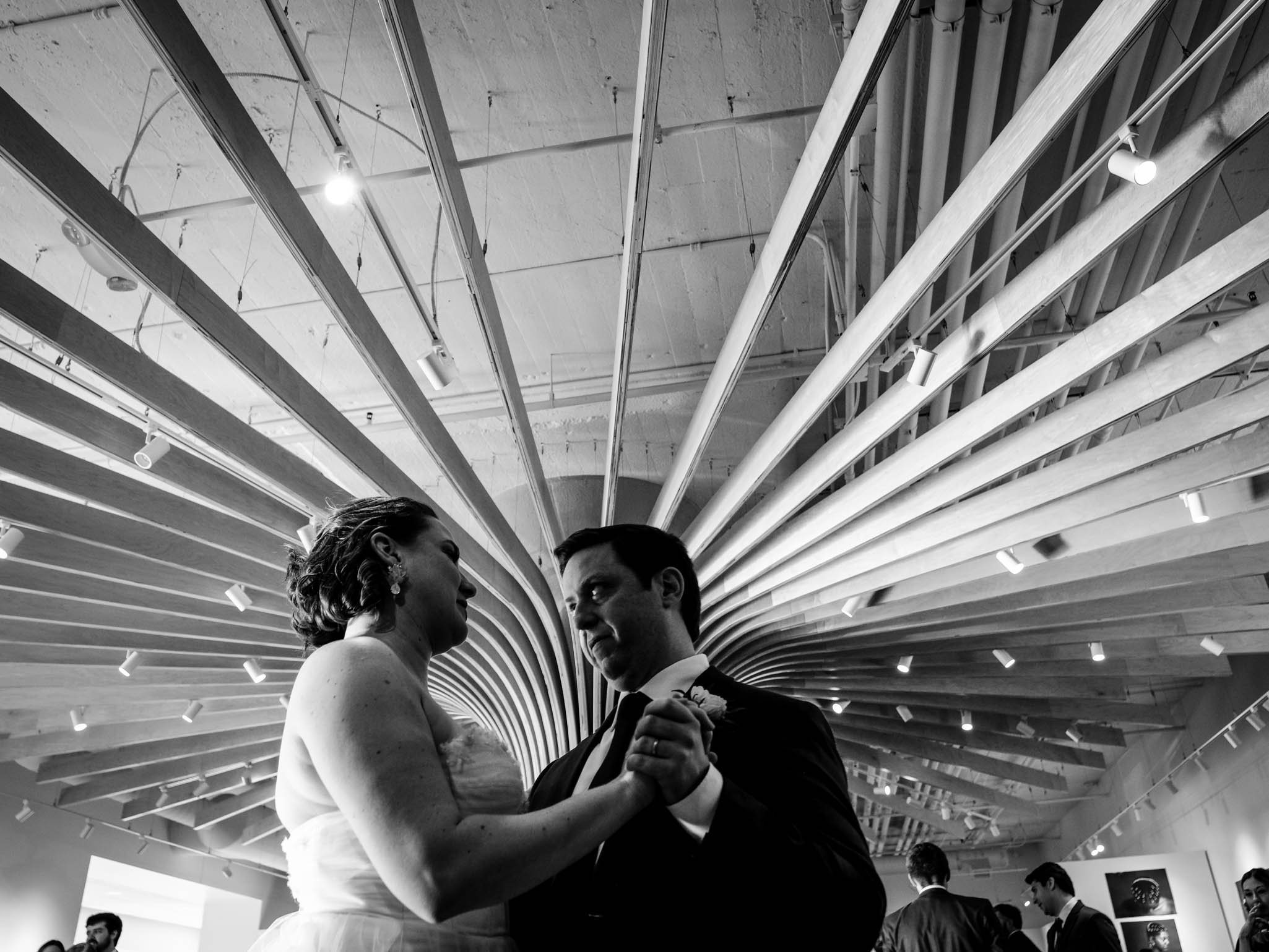 bride and groom dance their first dance at Milton Rhodes Center for the Arts