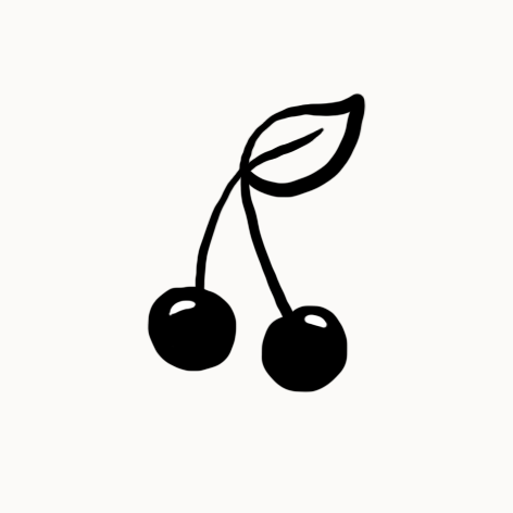 Deux cerises avec une feuille verte attachée à une tige