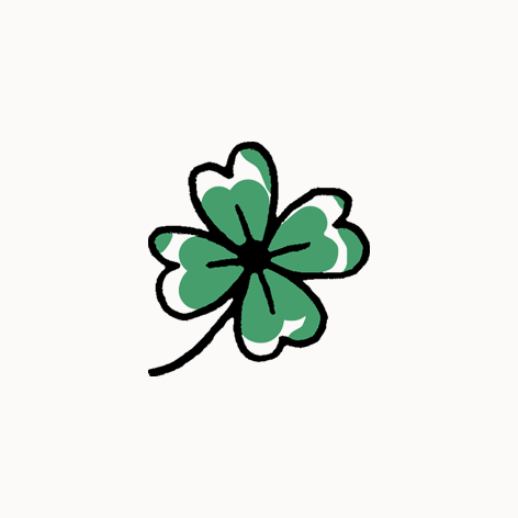 Trèfle à quatre feuilles avec des feuilles vertes et une tige noire.