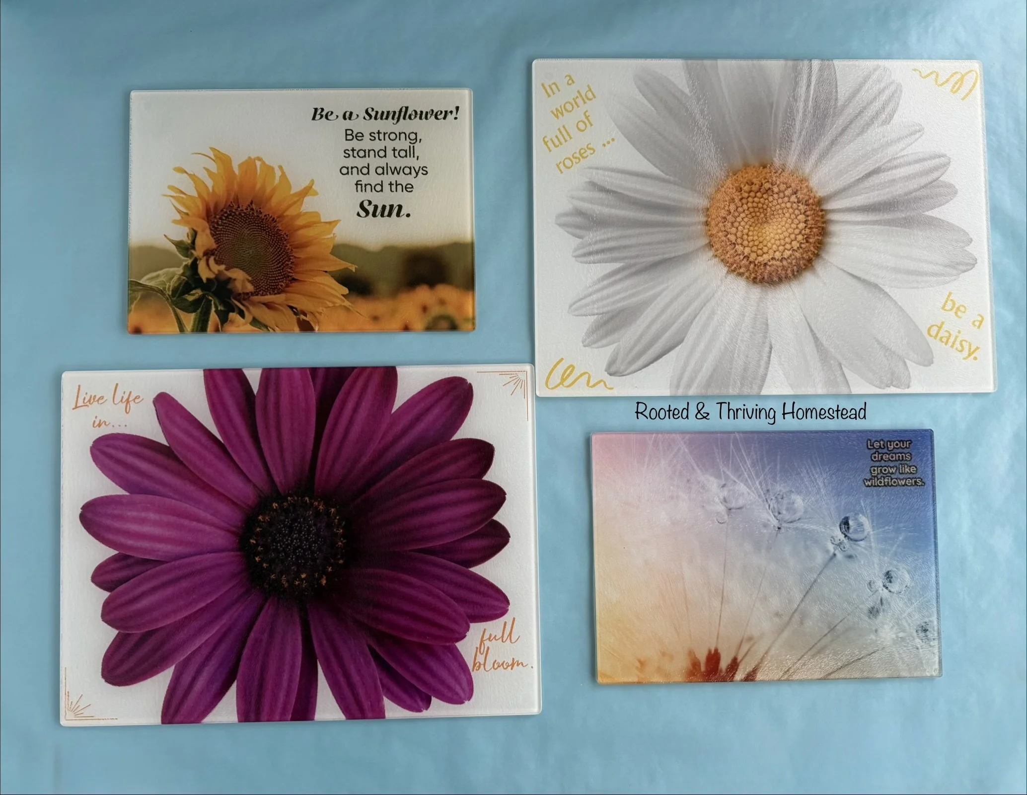 Decorative cutting boards with quotes and floral images that can be used for kitchen prep or as serving boards