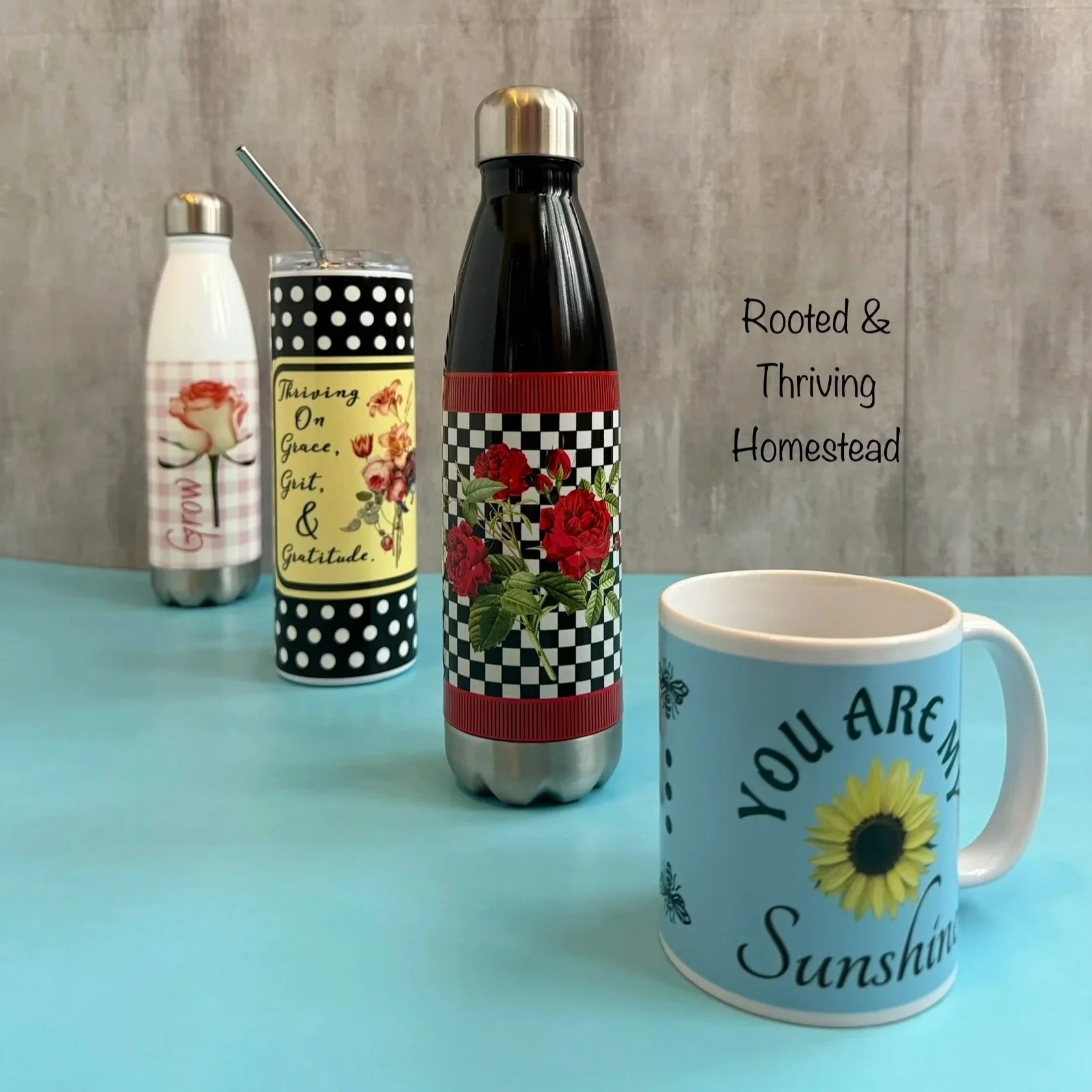 Selection of water bottles, tumblers, and mugs