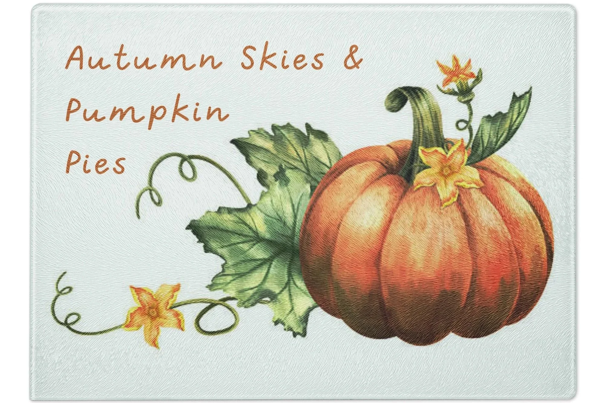 Tempered Glass cutting board with text "Autumn Skies  & Pumpkin Pies" and featuring a pumpkin on a vine with squash blossoms.