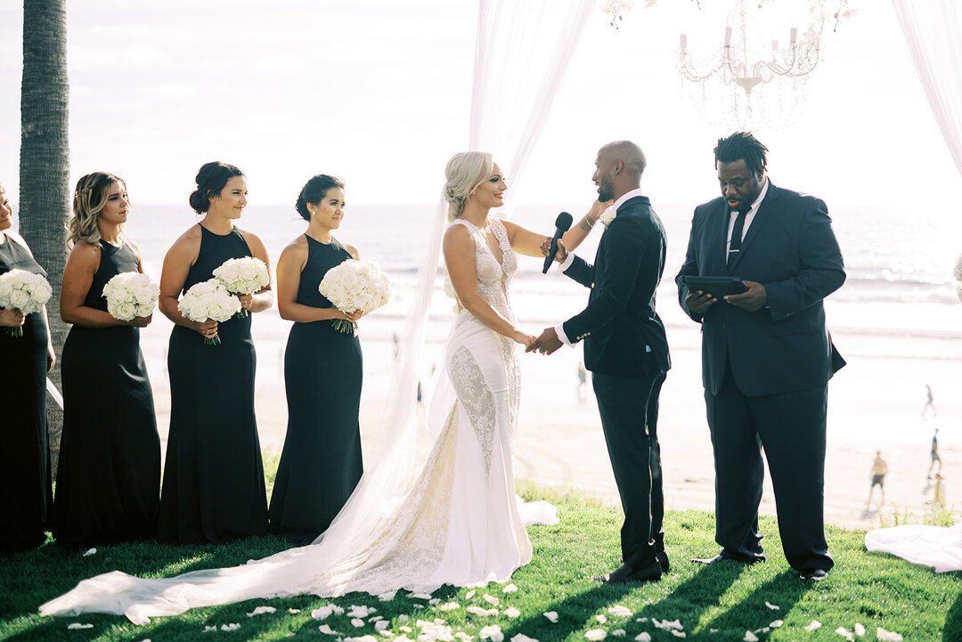 Saying &quot;I do&quot; in a timeless black and white coastal wedding setting 🤍🌴

Wedding Planning &amp; Design @taylordeckerevents 
Photo @christineskariphotography 
Videography @shoreandwave 
Florals @sacredromancefloral 
Rentals, Dance Floor, an