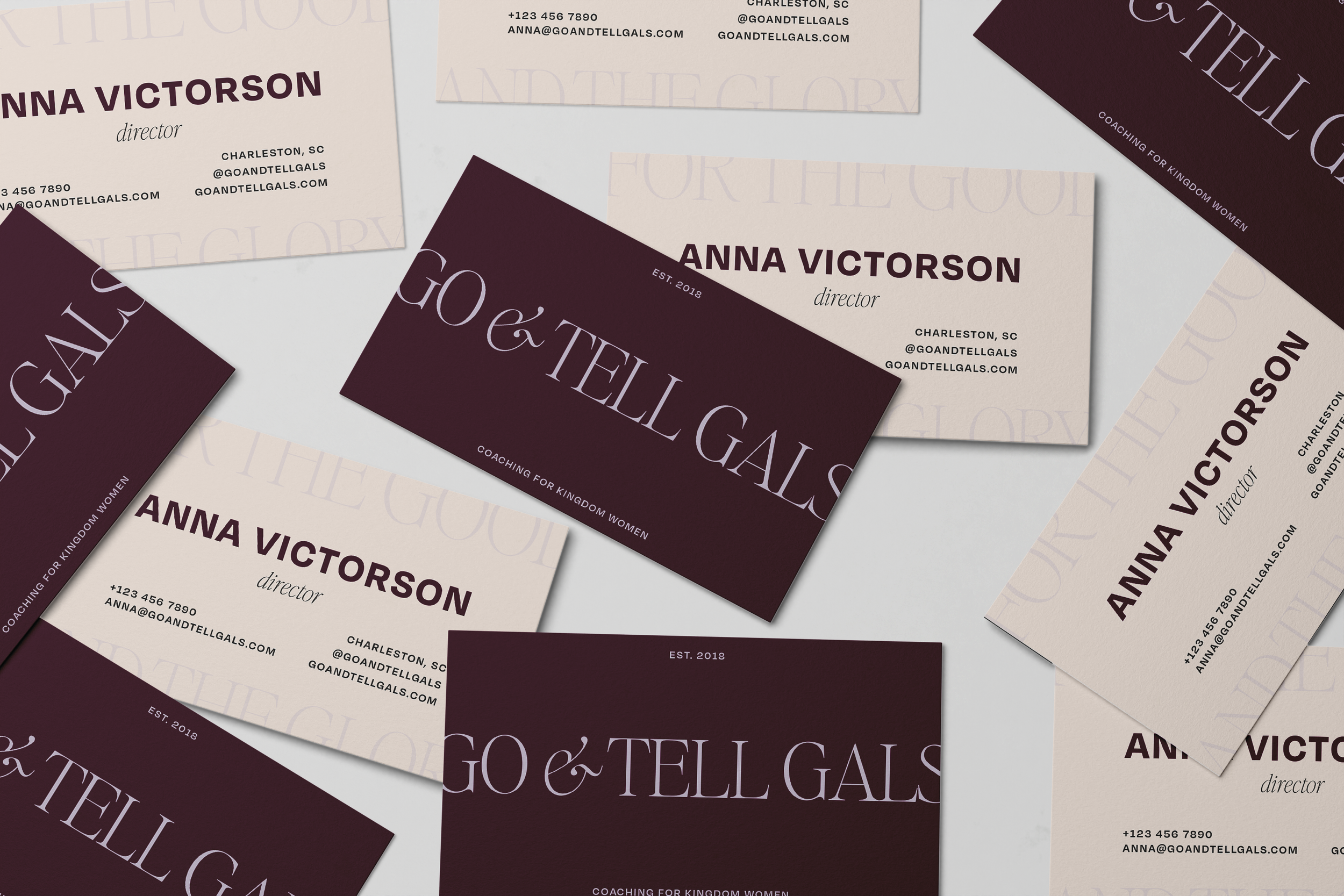 A collection of business cards for Anna Victorson, a director, featuring contact information, social media handle, and business branding in a cream and maroon color scheme with the company name 'Go & Tell Gals'.