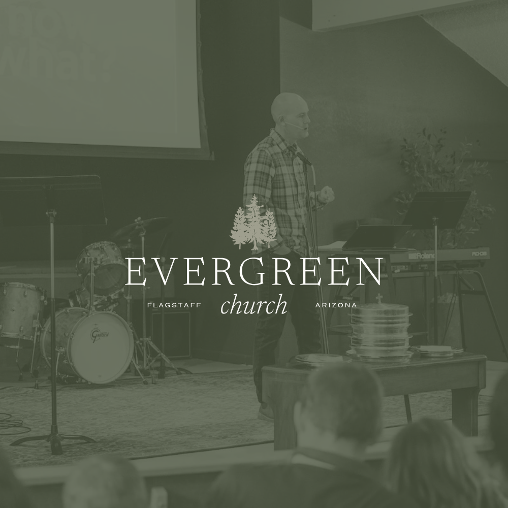 A man giving a speech or presentation at Evergreen Church in Flagstaff, Arizona, with musical instruments and a stack of plates on a table nearby.