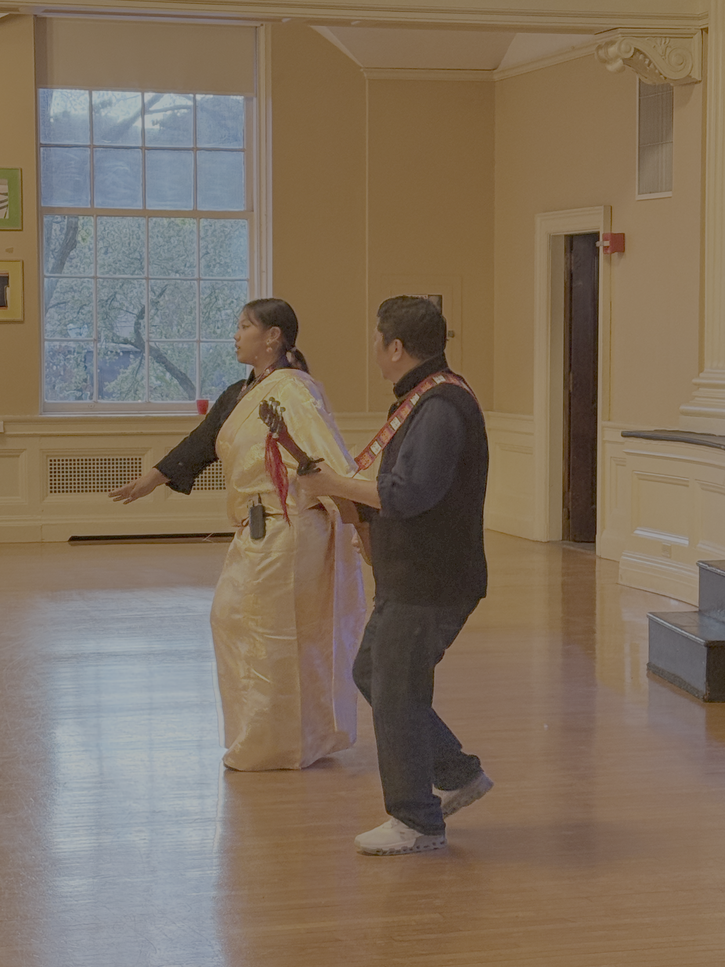 Tenzin Pasang and Migmar Tsering lead a Tibetan dance