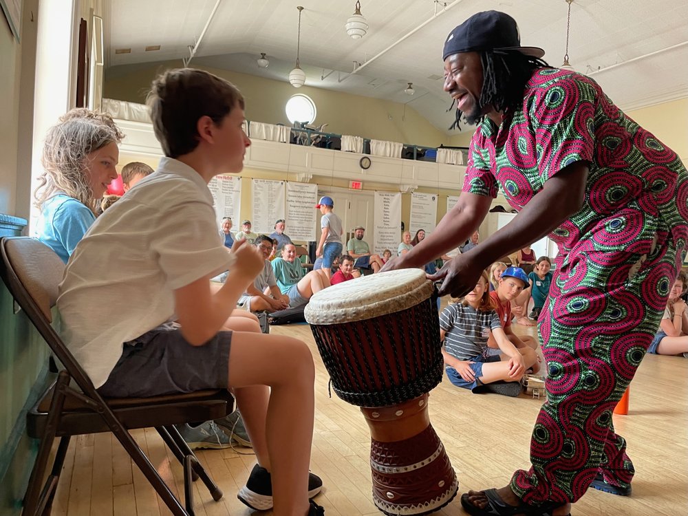 Trying a djembe with Ismael from Jeh Kulu Dance &amp; Drum Theater 