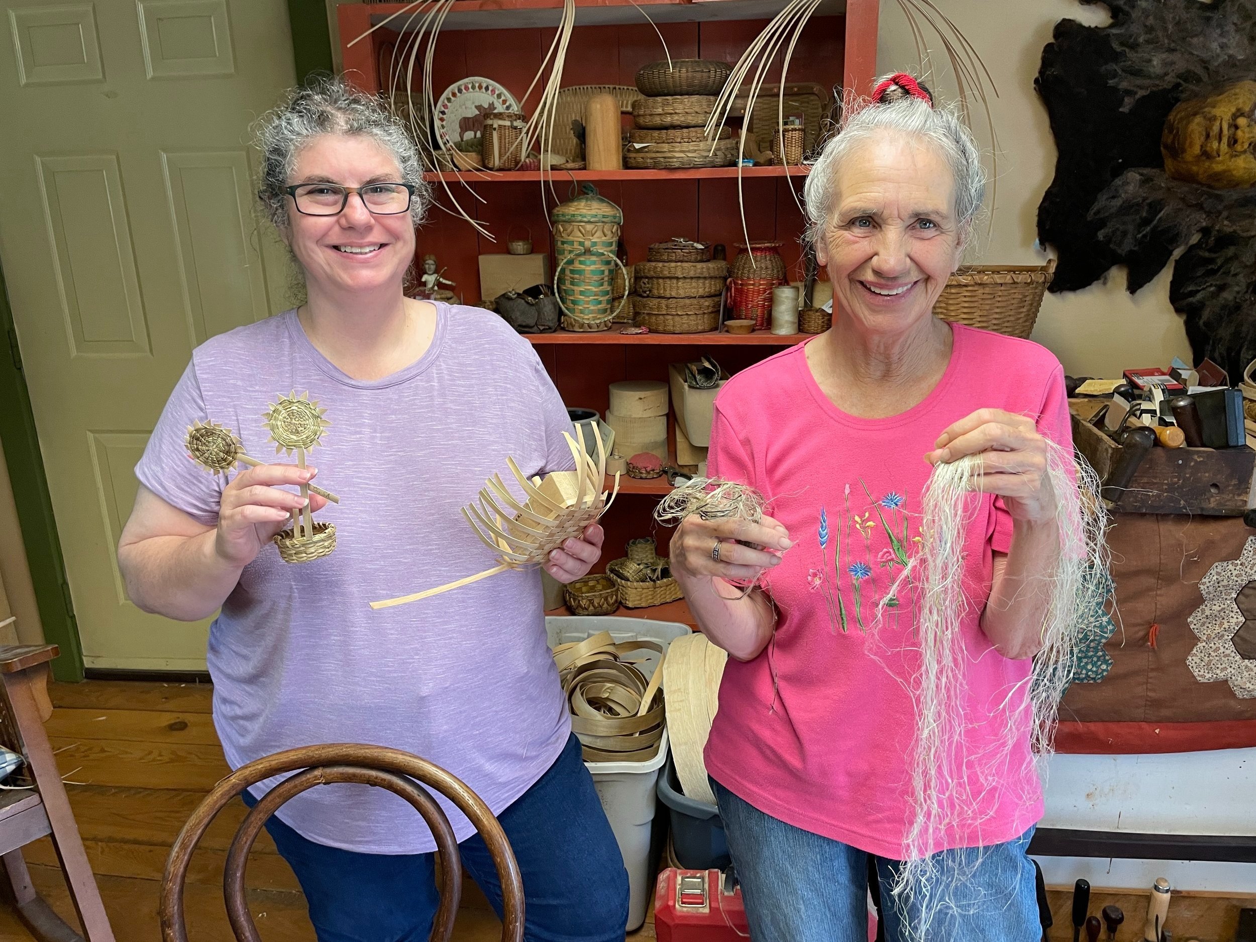Abenaki artists Vera Sheehan and Sherry Gould  displaying split ash and sweet grass basketry and milkweed fiber used in Abenaki fiber arts