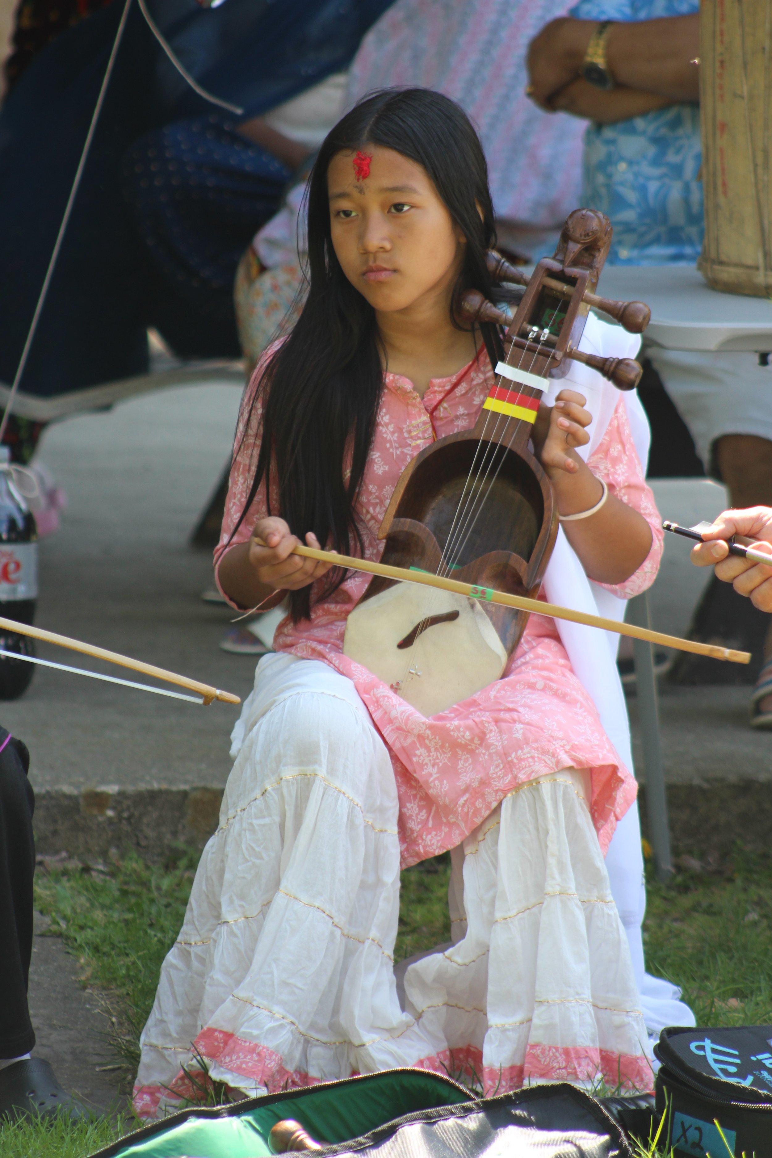 Bisasta Rai plays the Nepali Sarangi at the 2023 Sansari festival in Burlington, VT