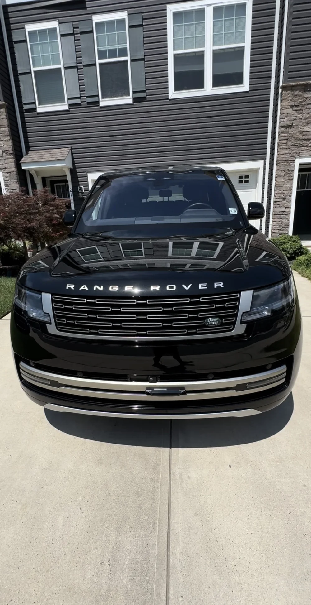 Black Range Rover detailed in a driveway