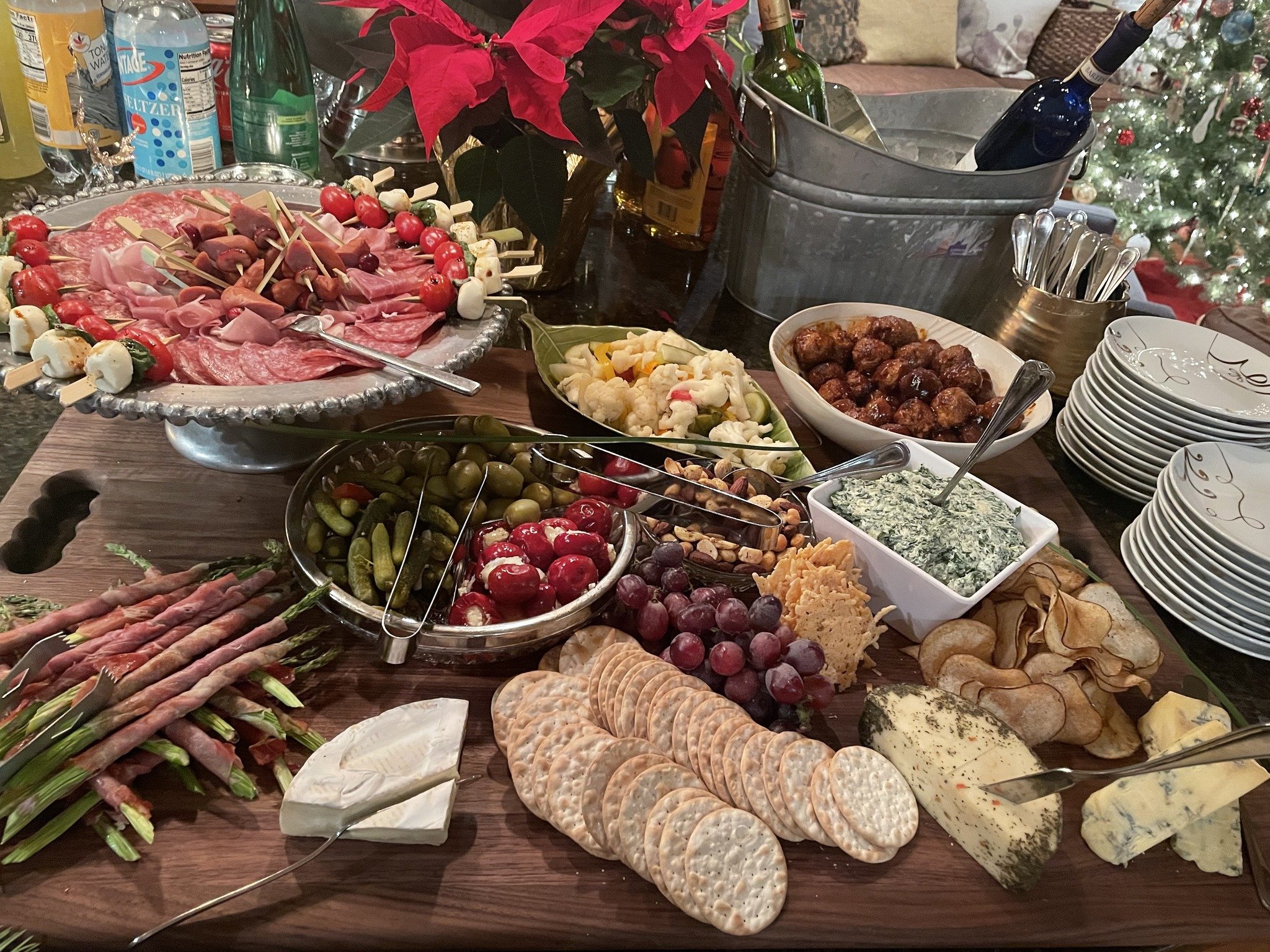 A Graze Board is a crowd-pleasing spread of tasty treats and delectable small bites.  Starting with charcuterie and artisanal cheeses, accompanied by fresh fruit, nuts, olives, and pickles, then finished off with some of our Chef's favorite light sna