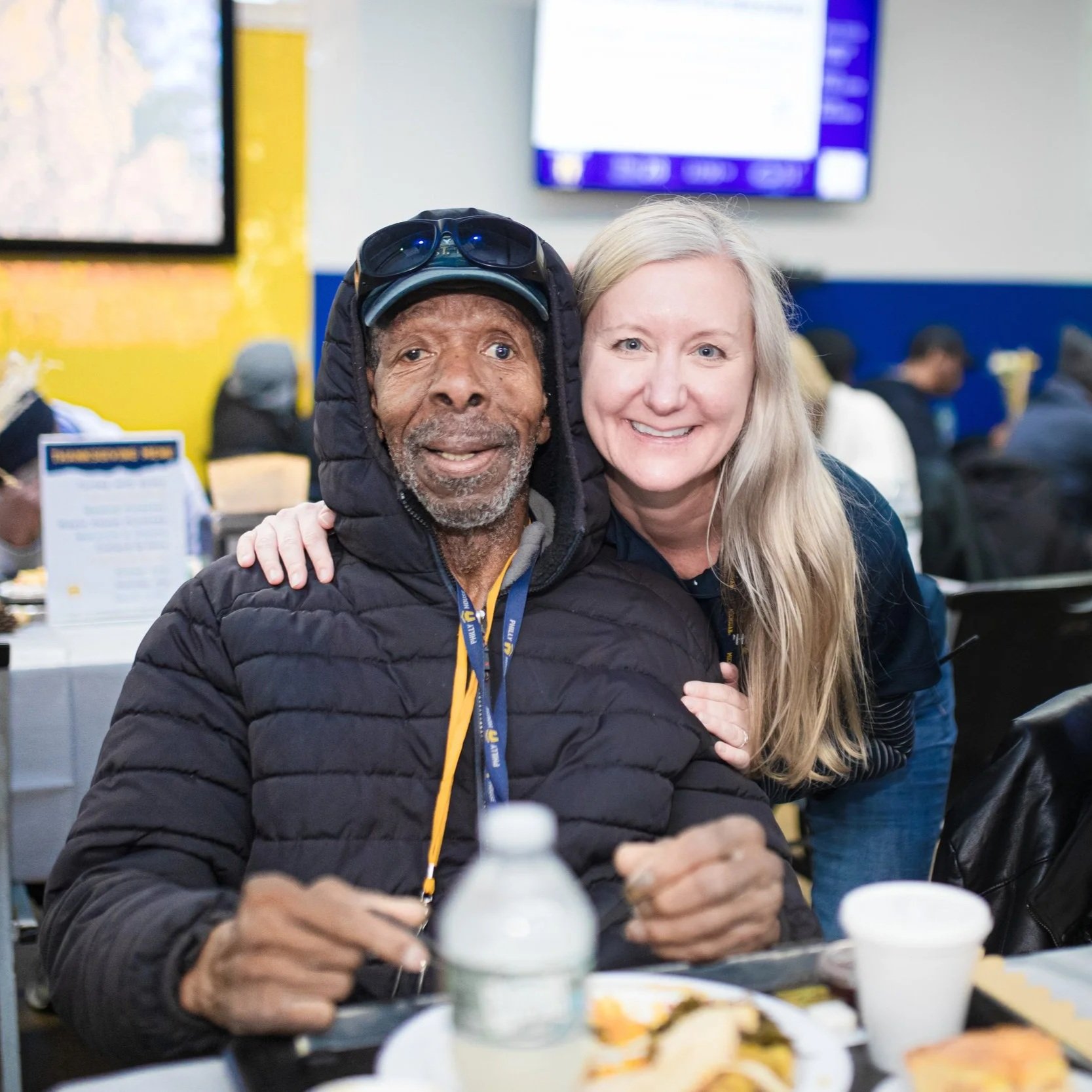 Photo of guest, Armando, with former homeless services director, Erin at Philly House Thanksgiving dinner. Click here to read the latest update to Armando's story.