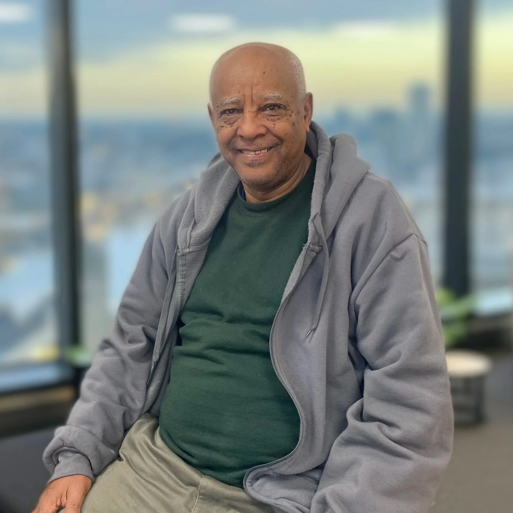 Philly House guest, Getachew sits smiling. Click here to read Getachew's story.