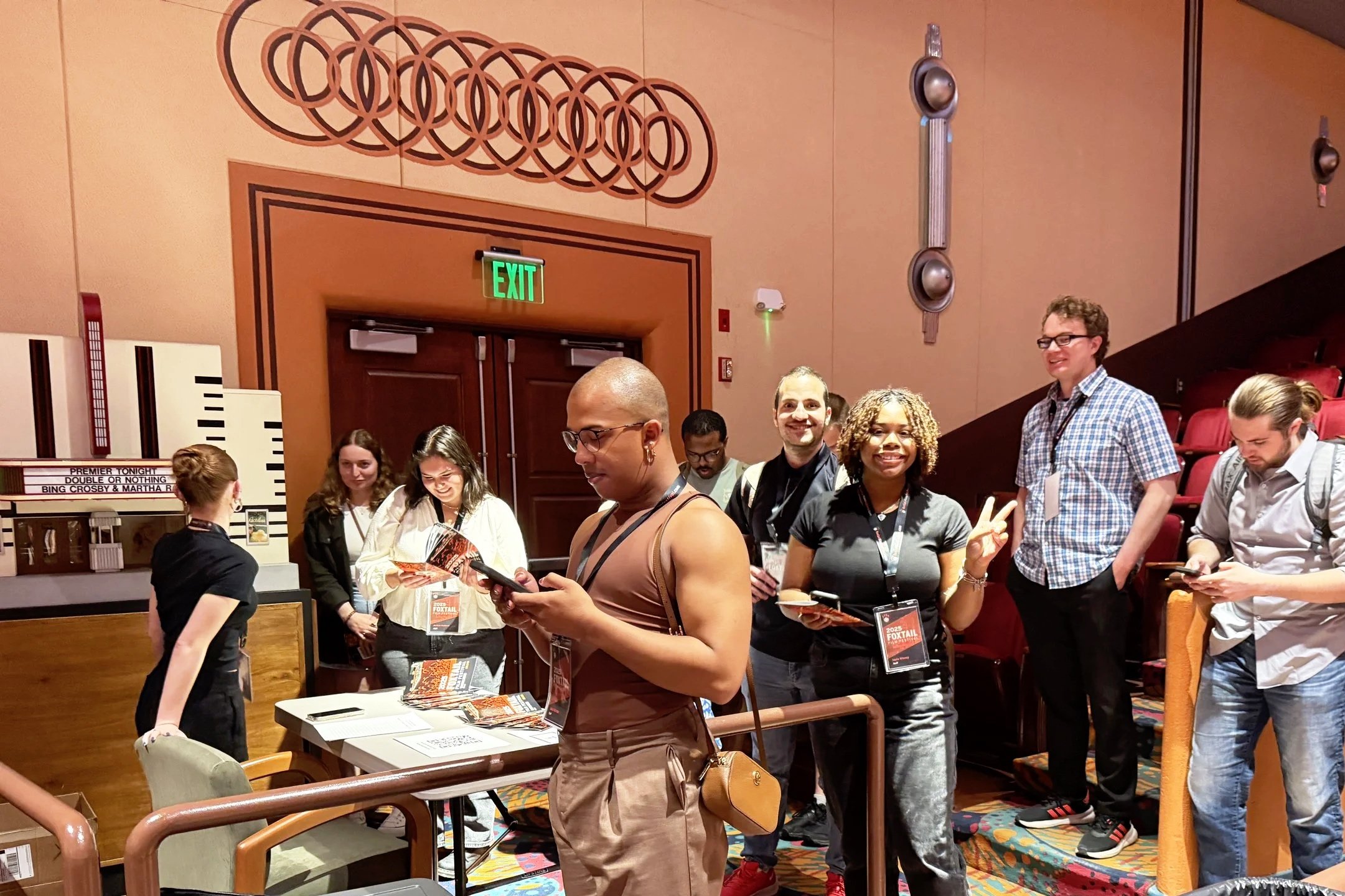 group of students in charge of running the festival event; location: interior Normal Theater;