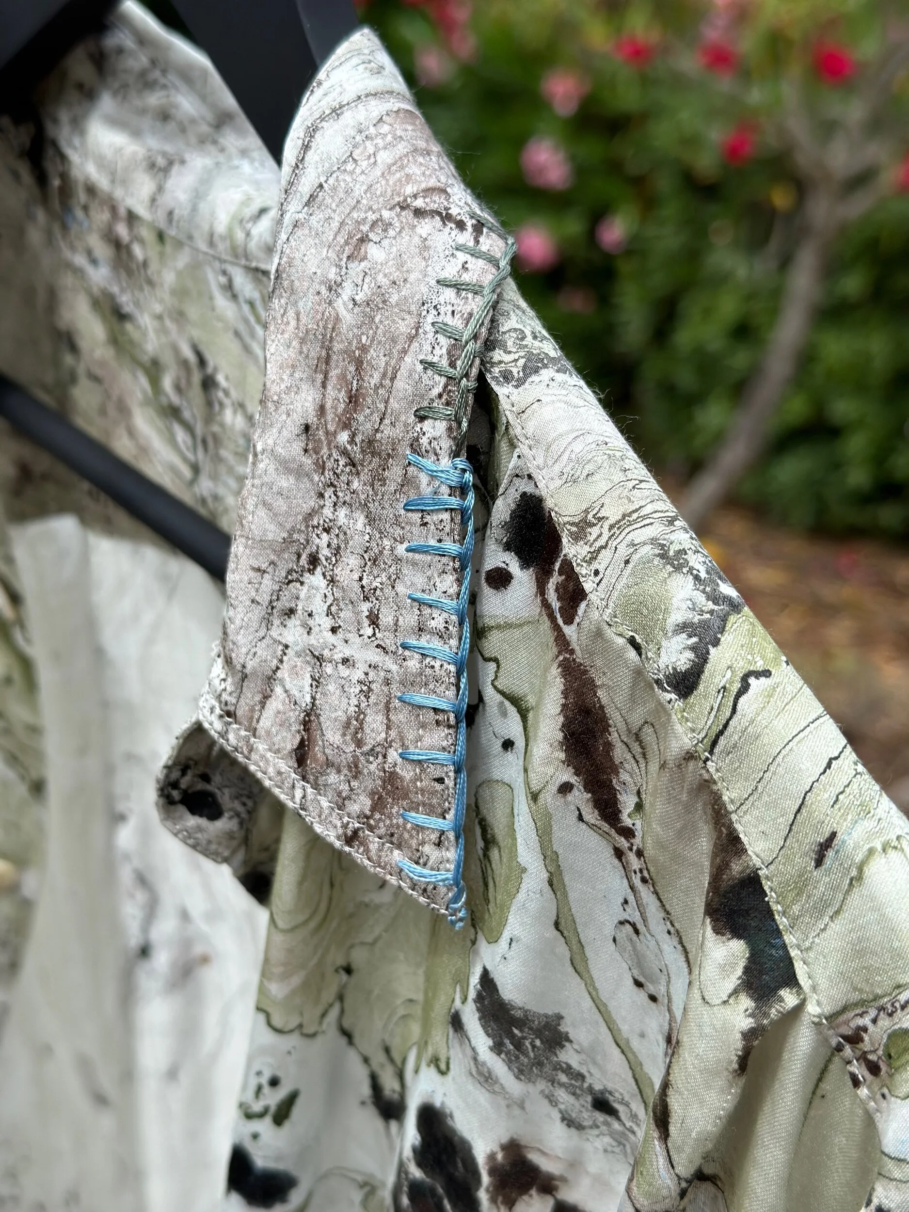 Detail of modal shirt’s fabric texture and stitching — sustainable luxury fashion