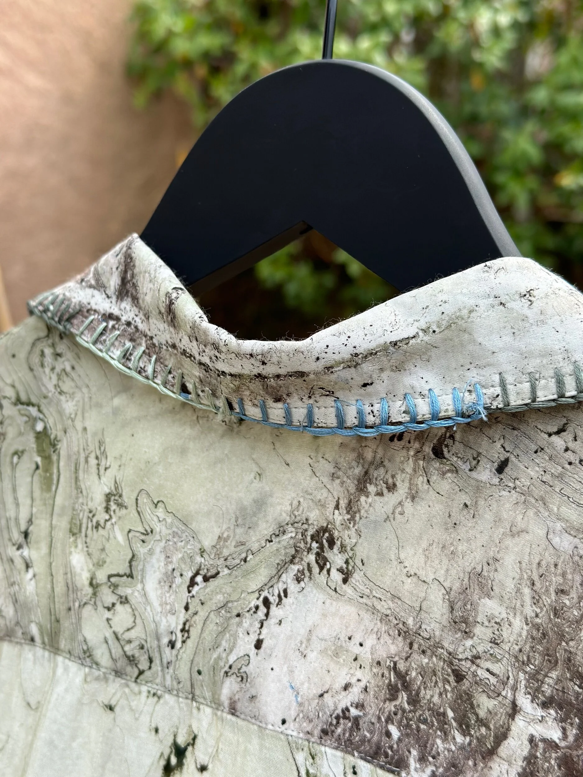 Back view of modal oversized shirt, flowing hem, artisan craftsmanship