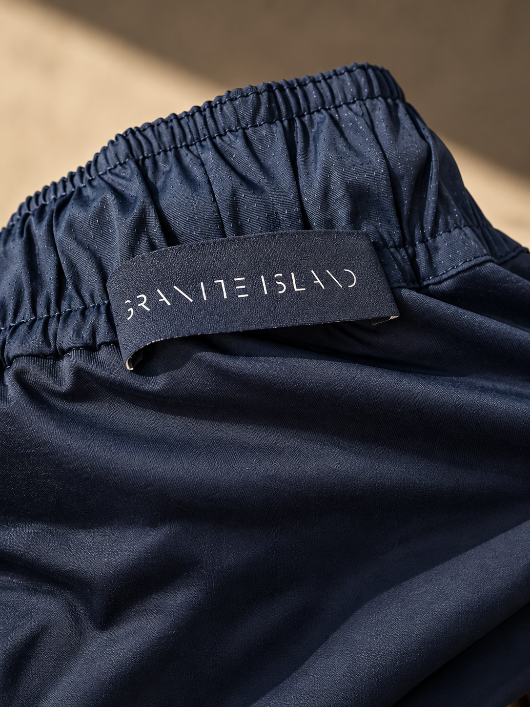Close-up of the soft Spanish Lycra lining inside Granite Island MONTECITO navy blue swim shorts, replacing traditional mesh lining.