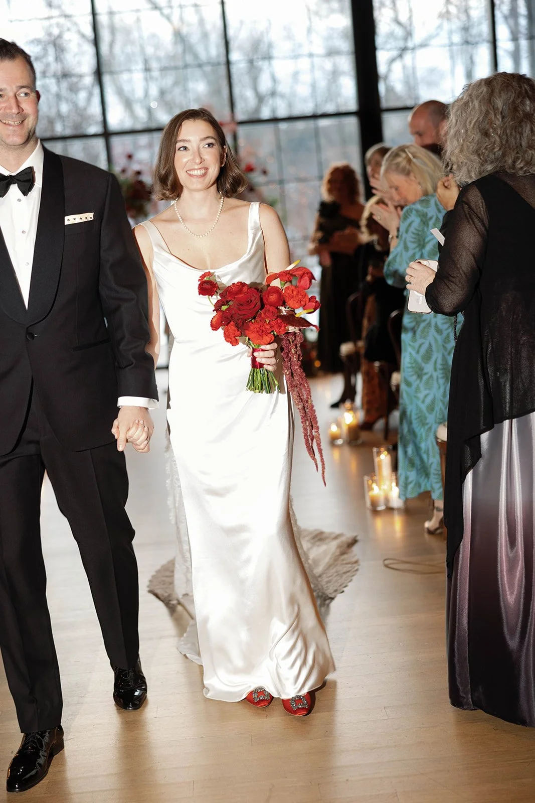 bride smiling on the walk back