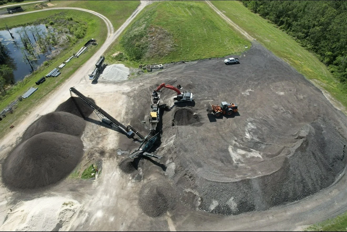 Aerial view of Knepp Construction mobile crushing operation with crusher, conveyors and aggregate stockpiles