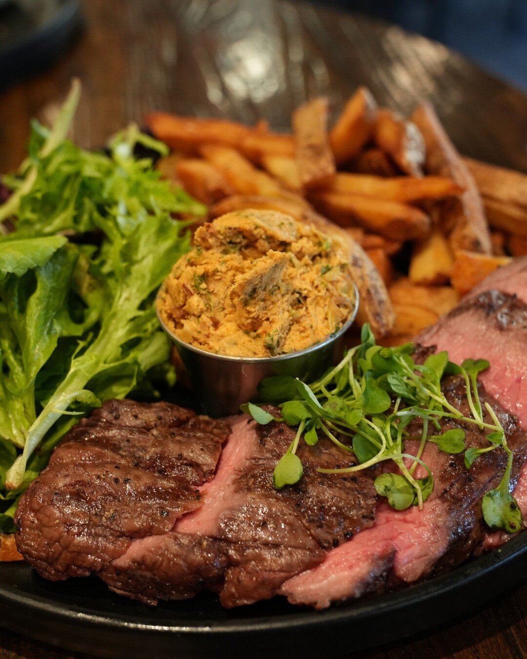 Our take on the classic dish Steak Frites is served with what we call Cowboy Butter, a special blend of herbs, spices, and secret ingredients that will have your taste buds two-stepping all night 🤠 

#cowboybutter #secretingredients #steakfrites #bi