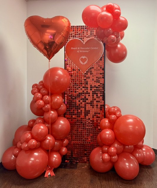 Red balloon backdrop shimmer wall Heart Center of Arizona