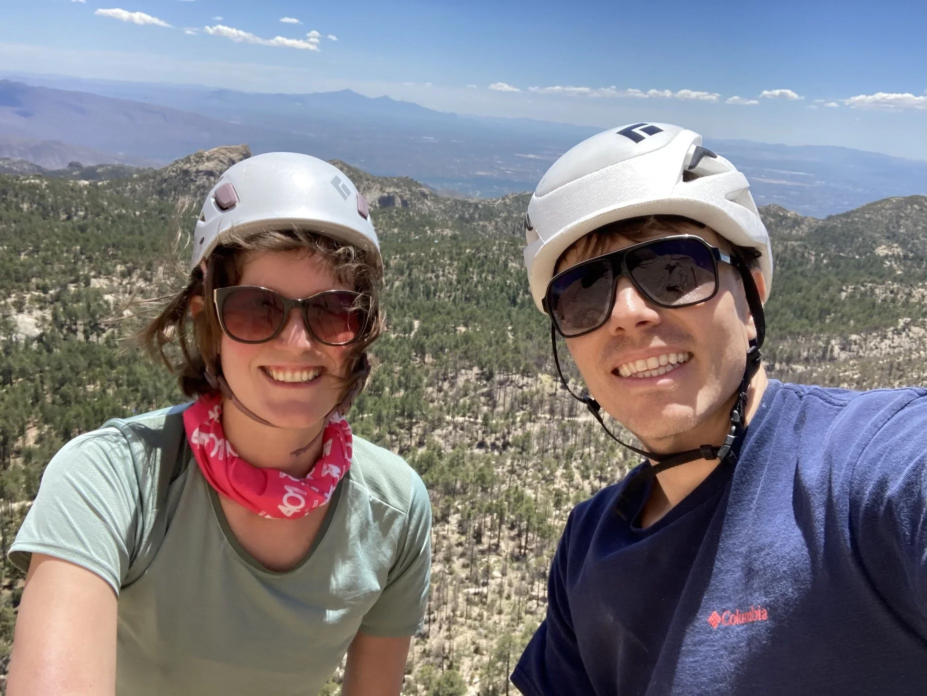 Two climbers in helmets at a Mount Lemmon overlook near Tucson.