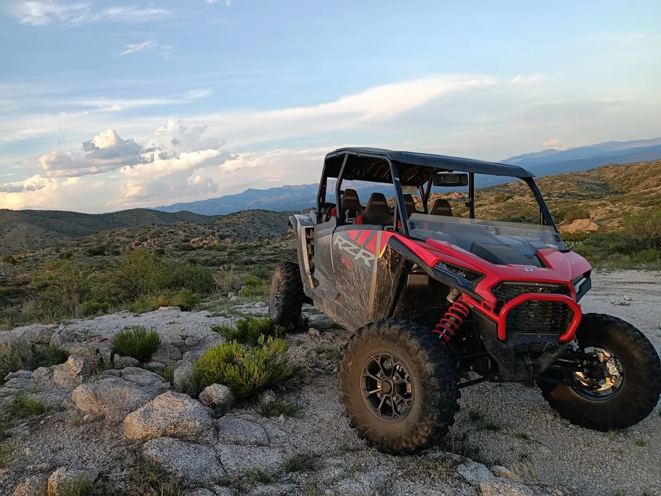 Polaris RZR four-seater driving on desert trails near Tucson
