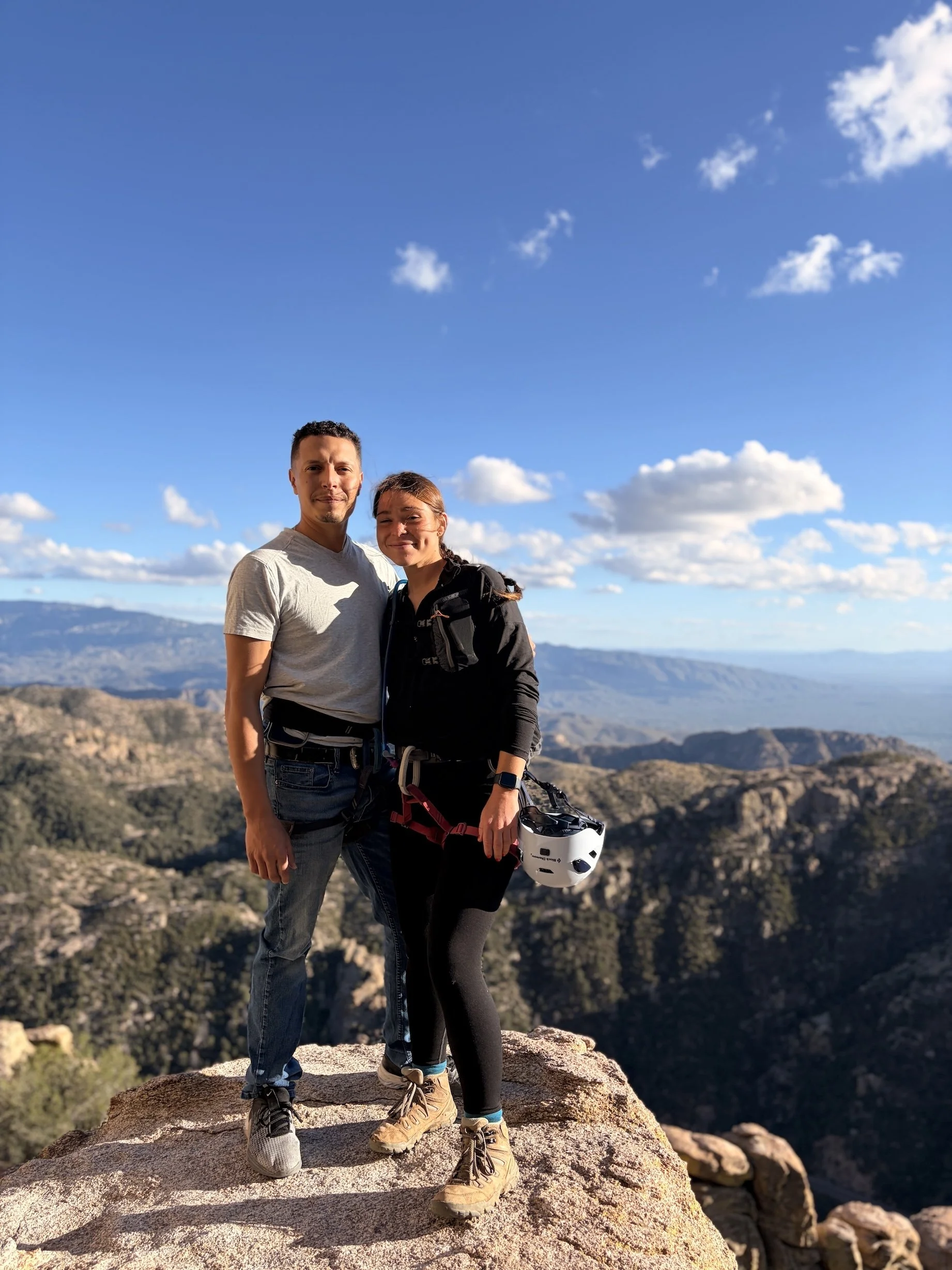 Couple enjoying a guided rappelling trip in the mountains above Tucson