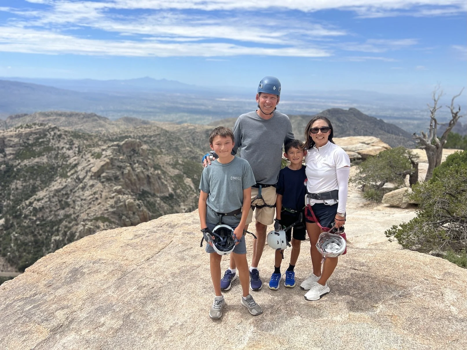 Family after a guided rappelling adventure on Mount Lemmon near Tucson