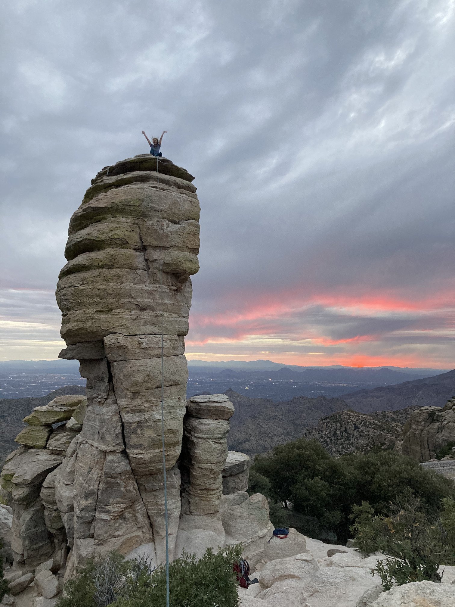 Climber standing on top of Hitchcock Pinnacle on Mount Lemmon.