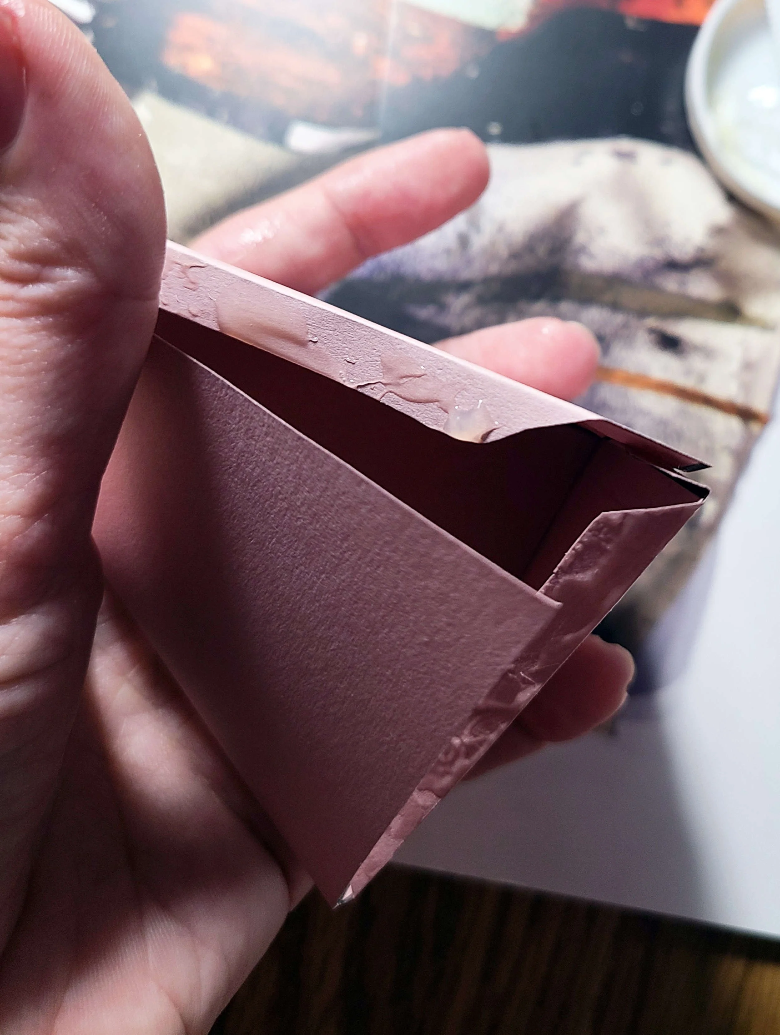 Put glue on the tabs and close.