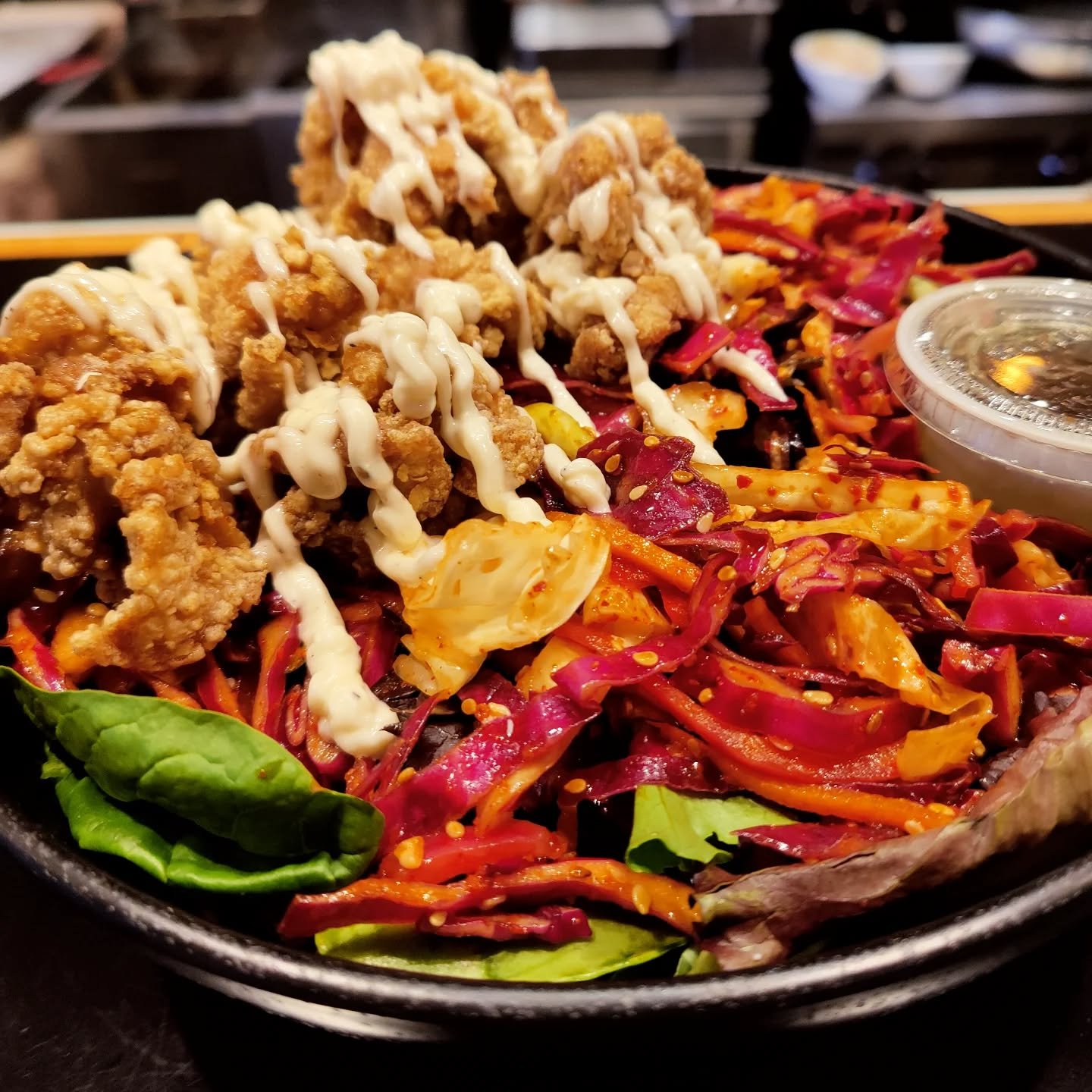 Perhaps you should ease into your 2025 New Year's resolution of eating more salad by putting some fried chicken on it! #friedchicken #salad #karaage #yuzuaioli #misovinaigrette #spicysesameslaw #eatlocal #lamorinda #moraga #orinda #lafayette