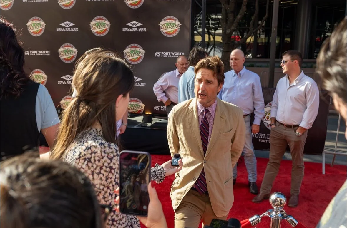 Luke Wilson giving an interview at a custom red carpet premiere event in front of a custom designed step & repeat.
