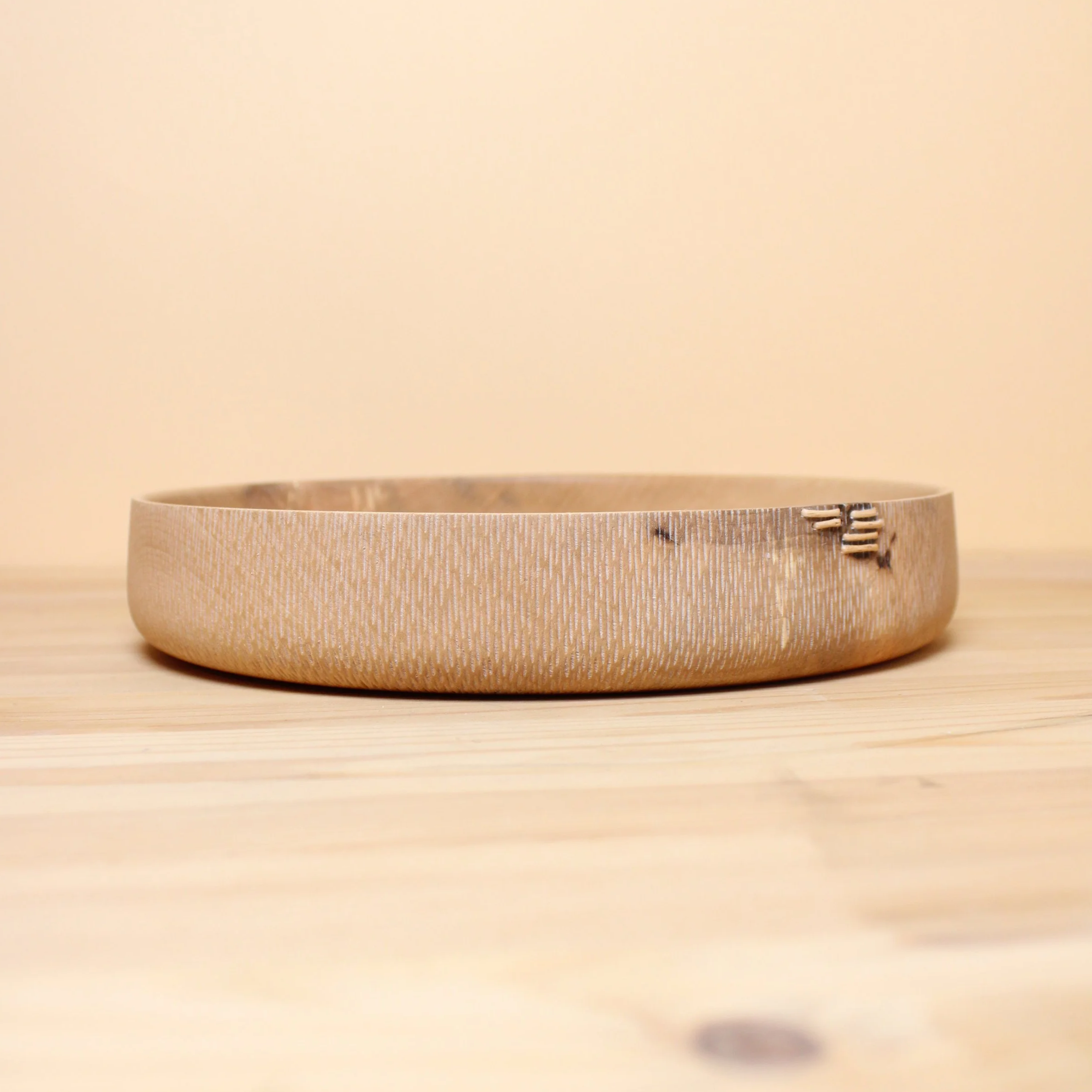 Bolle i lønn med tekstur med tægersaum