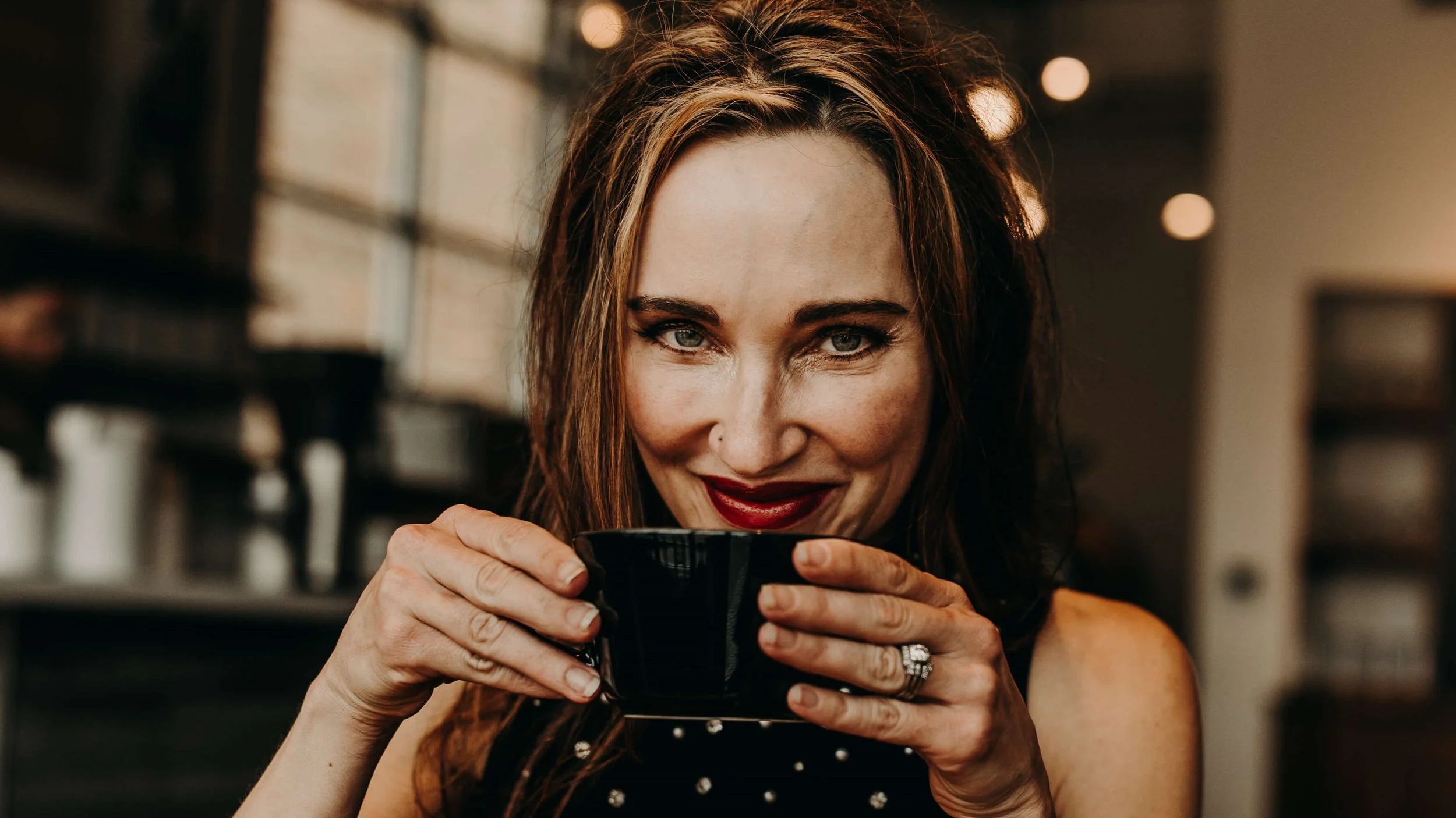 Dr. Alison R. Tendler Sipping Coffee From a Mug