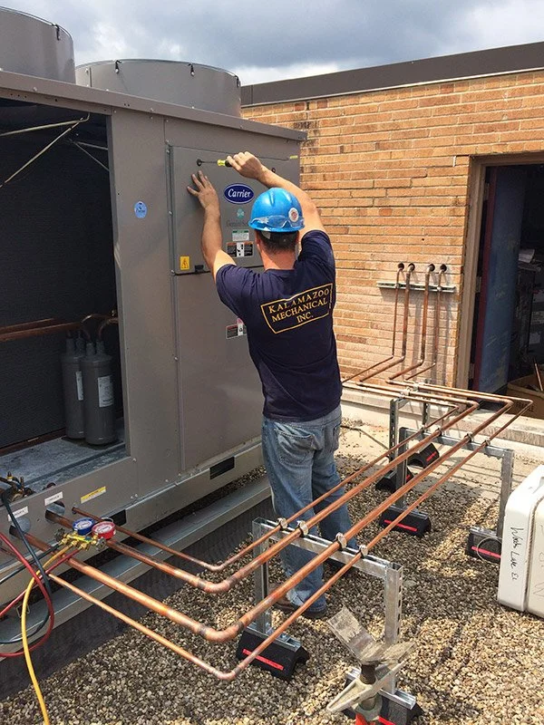 Service Tech working on HVAC Equipment