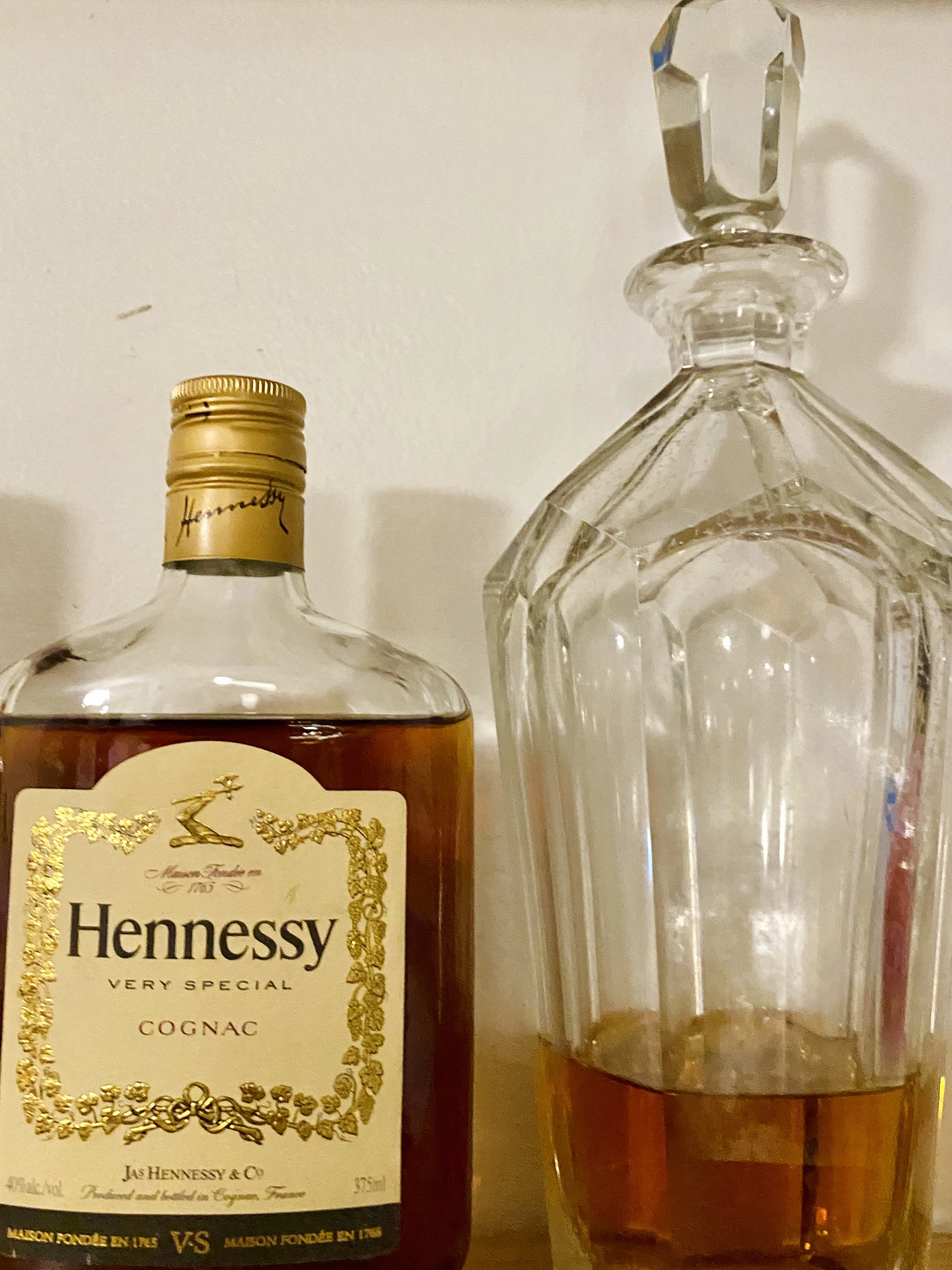 Cognac_Hennessy bottle on shelf next to crystal pourerIMG_9667.jpeg