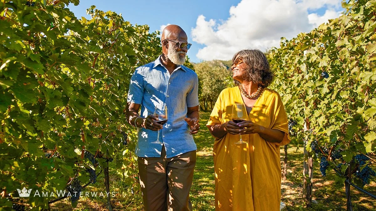Gai's French Cruise & Paris Trip_Black couple in vineyard IMG_7857.JPG