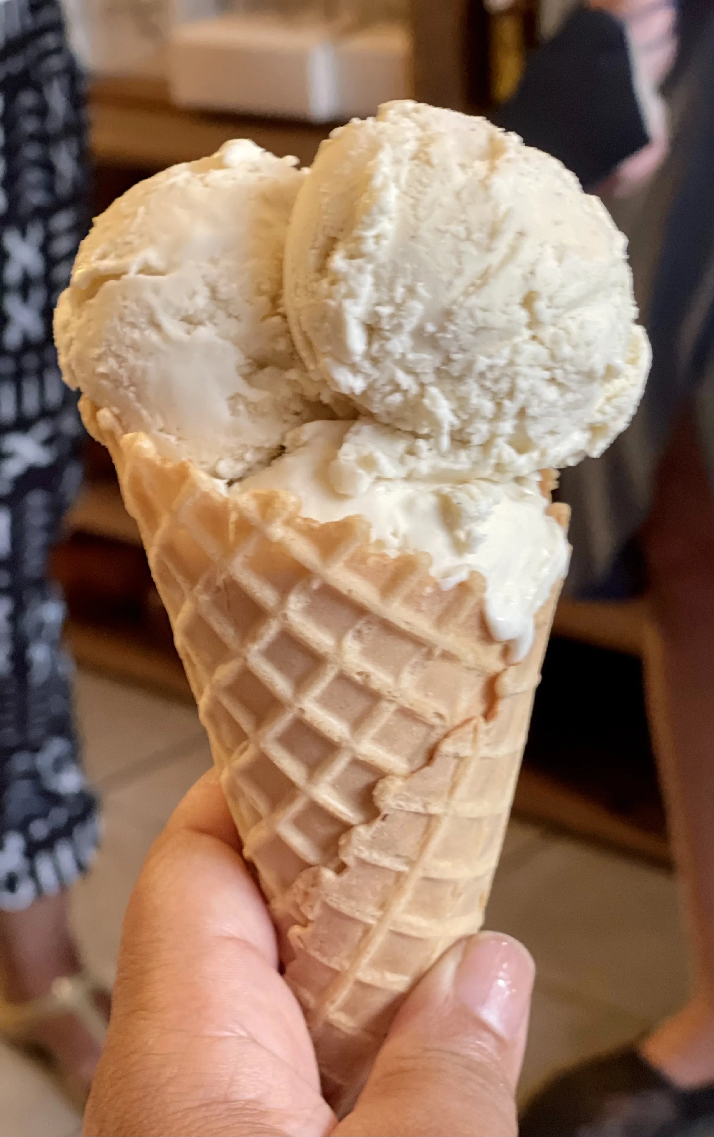 VANILLA ICECREAM_VEGAN in a cone TH holding IMG_6986.jpeg
