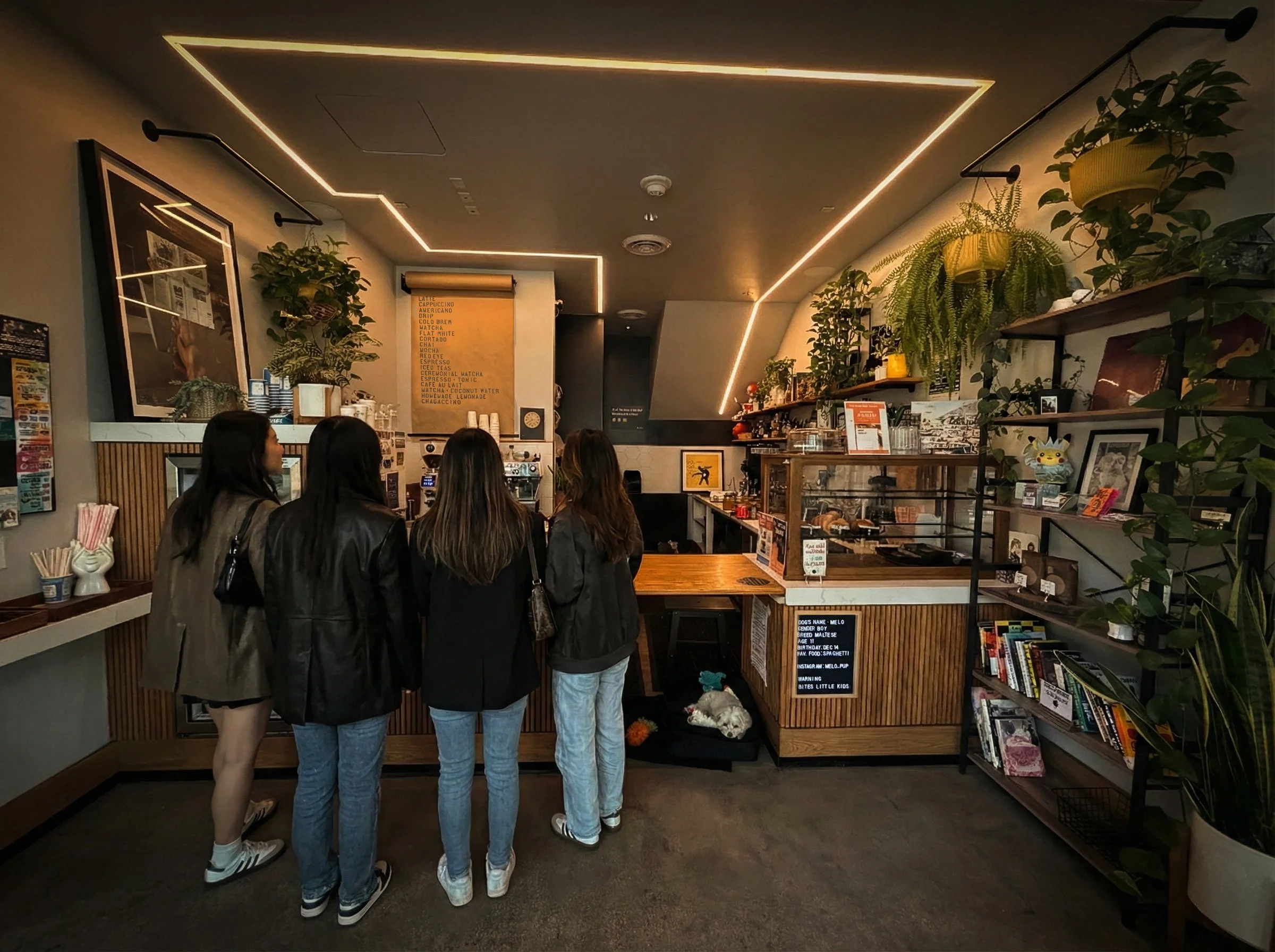 Four females waiting in line at Virtu Coffee in Downtown LA. They know the best place to get a latte or matcha in all of Los Angeles. Come to Virtu and see why people wait in line for this coffee.