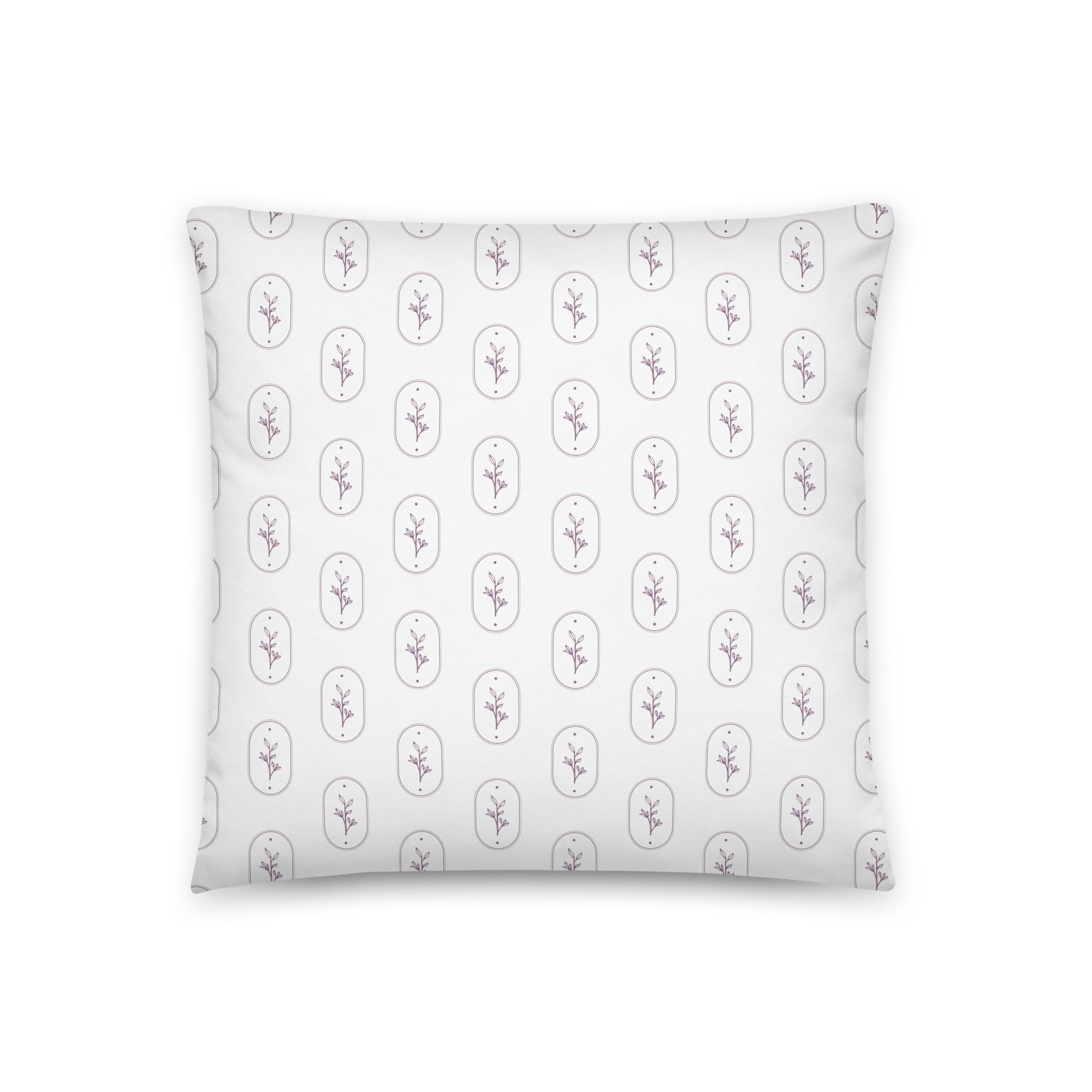 Pattern design for branding for women's health coach on a White pillow with a repeating pattern of small purple floral designs enclosed in oval outlines.