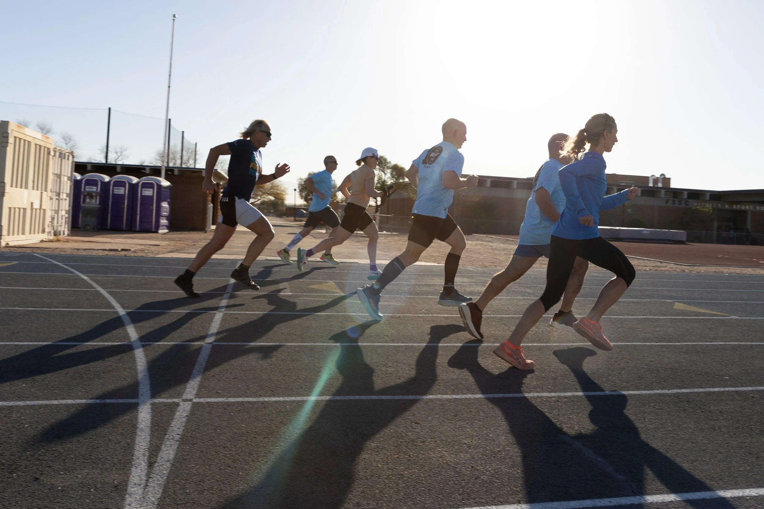 photo of athletes running strides