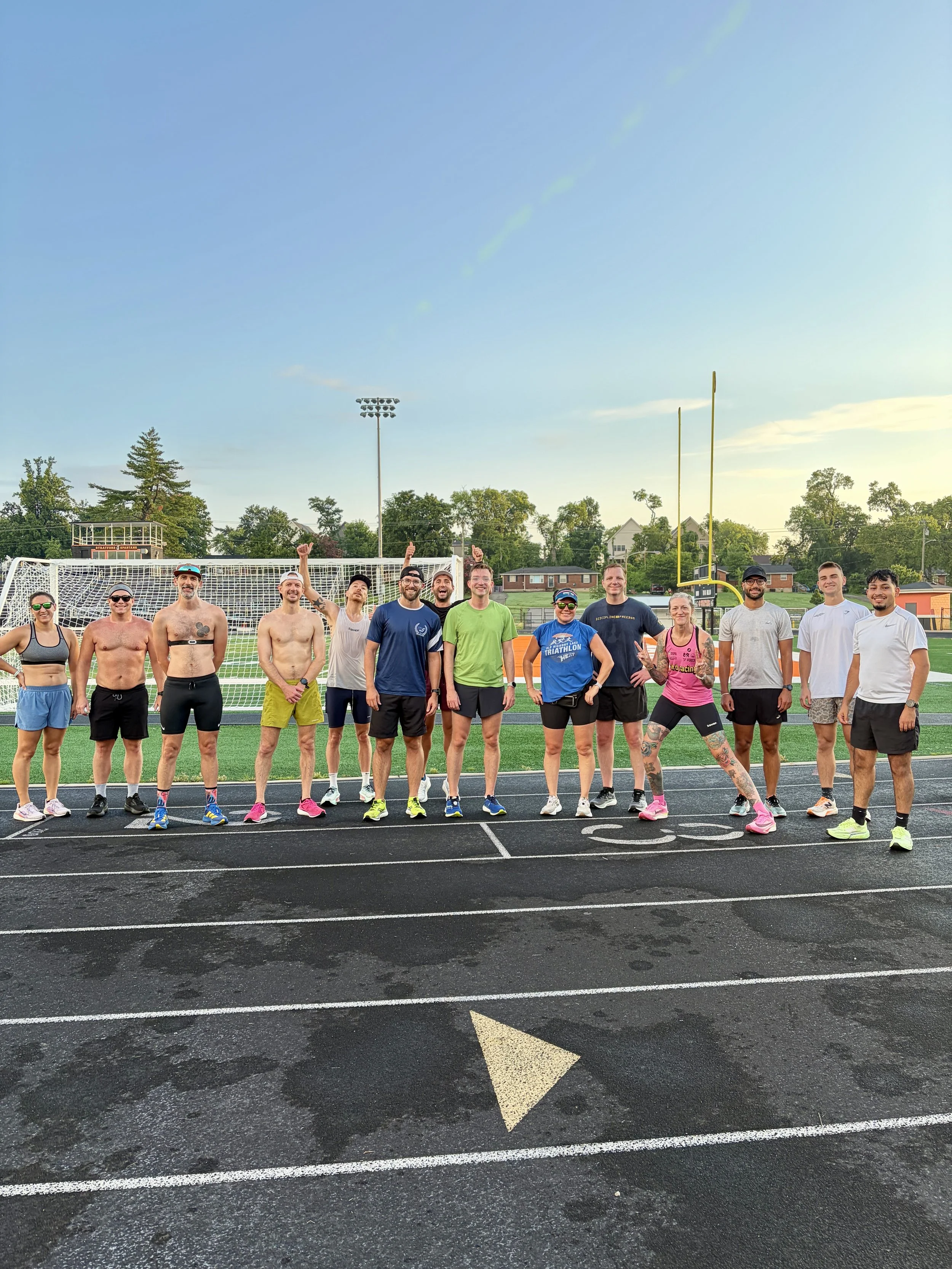 group photo of runners at the track